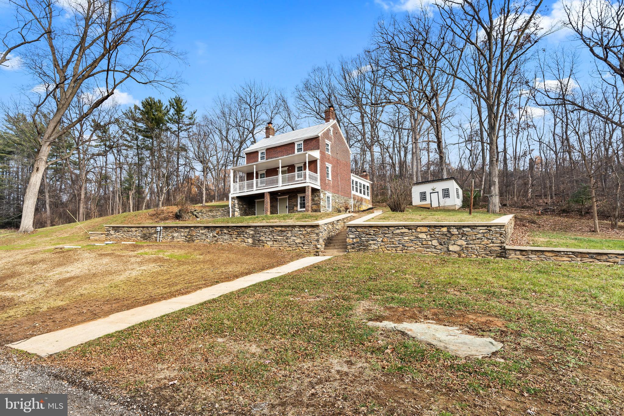 Completely remodeled all brick farmhouse on 3.5 acres with a pond.  The property also features a spring house, stone retaining walls and a detached building.  Sit on your front porch overlooking you're large front yard with a pond in sought after Myersville.  The home also has all new electric, plumbing, HVAC, well and septic system.  The inside is tastefully remodeled with a modern farmhouse style which includes 2 brick fireplaces, a completely new kitchen, 3 new bathrooms, new flooring throughout, new drywall and paint throughout.  Enjoy the privacy of 3.5 acres with the character of a farmhouse all with the modern conveniences of a new home.  Must see!!