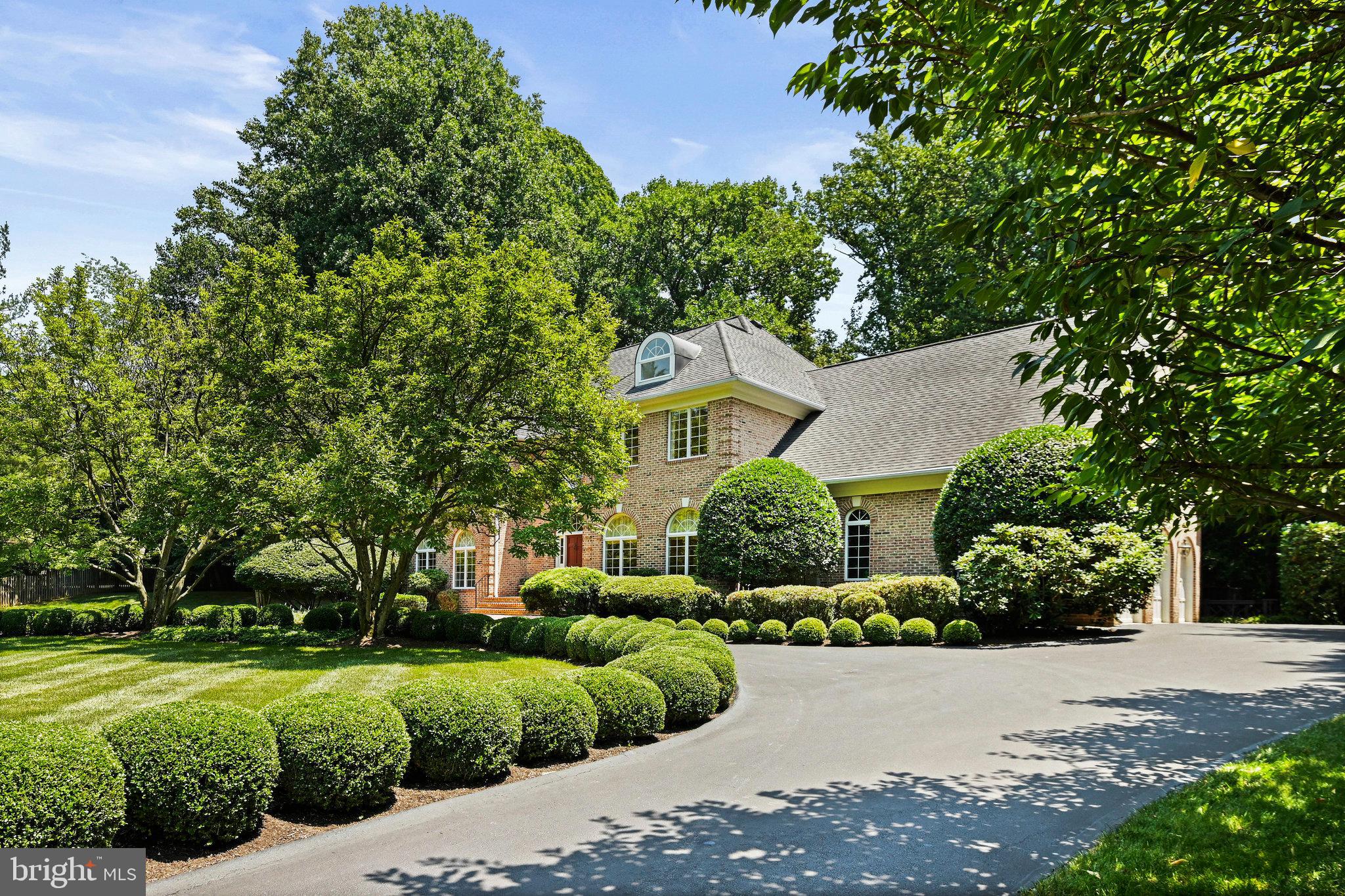 Welcome to a classic ‘Randolph Williams’ Georgian in prestigious Georgetown Place. The quality of construction throughout and the attention to details makes this residence one of the best values in McLean, Virginia. Some of the special features include hardwood flooring, a two-story foyer and family room, plaster moldings, three masonry fireplaces, a spacious primary suite and bath with heated flooring, a gourmet kitchen with bright breakfast room, a heated salt pool and spa with waterfall. All this is in a private enclave of 20 estate homes that provides easy access to Washington D.C., Tysons, National and Dulles Airports, Maryland and some of the best public schools in the DMV. 

The main level has a two-story Foyer with marble flooring, applied molded wainscoting, and a multi-tiered Austrian crystal chandelier. On opposite sides of the Foyer are the Living Room and the Dining Room. The Living Room has a wood-burning fireplace, a marble hearth, double large casement Palladian windows, and plaster crown egg and dart molding. The Dining Room also has double large casement Palladian windows, applied molded wainscoting, and wide crown molding. It also features an 18th-century reproduction two-tiered pewter chandelier. Leading from the Dining Room to the Kitchen is a Butler’s Pantry with cherry cabinets, a Kohler sink, gold-plated faucets and handles, plus wide crown moldings. The ceramic-tiled Kitchen has custom cherry cabinets with wire basket knobs. A central feature is a   large cooking island with a granite countertop, a 5-burner gas Thermador cooktop, and multiple drawers and cabinets including a Thermador warming drawer. Other features include a Sub-Zero refrigerator and freezer, a Bosch dishwasher, and a large Kohler sink with an Instant Hot dispenser. Just off the Kitchen is a light-filled breakfast area with a bay window that overlooks the very large patio deck and the in-ground saltwater pool. Another door from the Kitchen leads to the Mud Room/Laundry Room which has a GE washer and dryer, ceramic tile flooring, a large laundry sink, built-in shelving and cabinets, a second refrigerator, and a double coat closet. for those entering from the over-sized three-car garage. From both the breakfast room and the front Foyer, one can reach the two-story Family Room. This room is dominated by a two-story ceiling and a stone, wood-burning fireplace with a raised hearth. Windows with arched transoms provide light, and French doors lead out to the patio deck and pool.
 
Stairs from the Foyer lead up to a large hardwood landing on the upper level. This level contains four bedrooms. These include a Primary Bedroom suite, two spacious bedrooms with walk-in closets that are connected by a two-sink bathroom with a shower/tub, and a third bedroom with an en-suite bathroom with shower. The Primary Bedroom has an architectural window wall, a gable ceiling, and  two large  walk-in closets. The bathroom features a heated floor, oak cabinets, a large linen closet with multiple shelves, a large walk-In shower with two adjustable heads, a private commode area with bidet, and a soaking jacuzzi tub. This bathroom has a vaulted ceiling containing a skylight.

Stairs from the Foyer lead down to the home’s lower level which has a large recreation room with an oversized masonry fireplace with raised hearth, half-timbered walls with raised oak paneling wainscoting and textured plaster, coffered ceiling and recessed lighting. Oak Bar that is a full 12 feet with raided panel sections divided by columns with carved capitals, brass foot rail and room for an ice maker and refrigerator and it is finished with a twin Kohler sink. 
There are two other large rooms one with twin closest and halfway full bath. There is plenty of storage space in the unfinished area with its own large cedar closet.