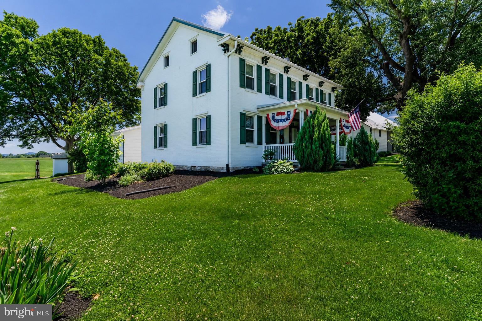 Welcome to 895 Eppley Road, a picturesque farmette nestled on 5.54 scenic acres in Monroe Township. Rich in character and rural charm, this circa 1870 farmhouse offers 5 bedrooms, 2 full baths. The inviting living room features a cozy propane fireplace, while the formal dining room showcases elegant chair railing. A spacious eat in kitchen with crown molding serves as the heart of the home, complemented by a first floor bedroom, mudroom with washer/dryer, and full bath with a side entrance whirlpool tub. Upstairs, you'll find the primary bedroom, three additional bedrooms and a full bathroom. At the front of the house is a spacious covered front porch, perfect for relaxing and enjoying country summer breezes. Enjoy the expansive wood deck off the kitchen entrance overlooking the beautiful property and countryside. The property is exceptionally equipped with a large bank barn, bonus barn/shed, block shed, three car garage, ideal for farming, storage, or workshop space. A chicken coop is adjacent to the garage. The beautifully landscaped grounds feature a tranquil goldfish pond and a fire pit area, creating the perfect setting for outdoor entertaining and peaceful country living. A rare opportunity to own a charming farmette with endless possibilities.