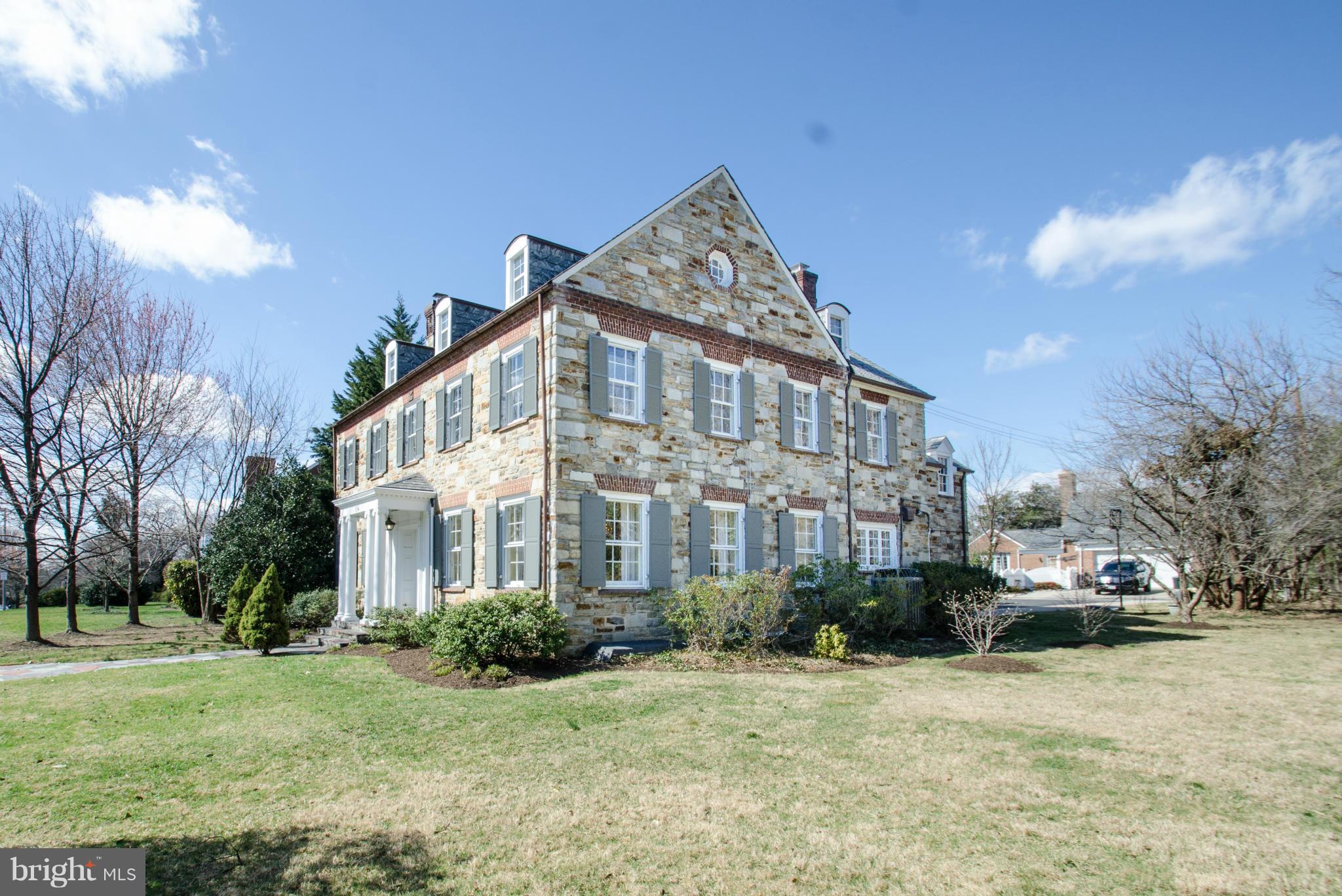 SIZABLE PRICE REDUCTION! DISTINGUISHED 3 STORY CENTER HALL COLONIAL SOLID STONE HOMELAND HOME w/ 5 BR & OVER 4900 sq ft of Incredible Details, HW Floors, Custom Moldings on .45 Acre, Approx.  Formal LR & DR, Updated Kitch. w/ SS Appliances & Carrera Marble Counters, Solid Walnut Paneled Library/Study w/Barrel Vaulted Ceiling, Marble MB, LL Clubroom w/ Banquettes & Bar. OPEN SUN. 5/21 12:30-2:30!