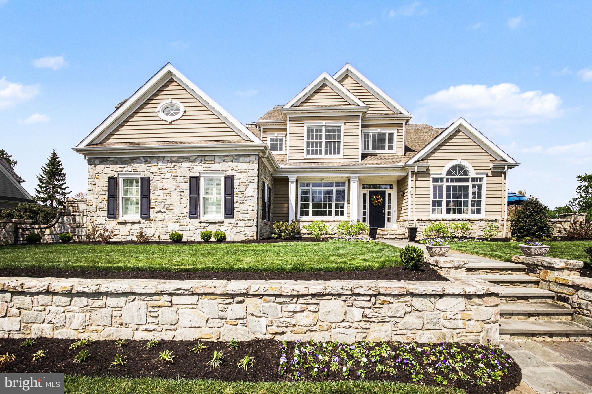 Thoughtfully reimagined by its current owner, nearly half-acre homesite within the prestigious Bent Creek Country Club community, this exceptional residence blends timeless architecture with extensive modern upgrades. With captivating curb appeal and thoughtfully enhanced interiors, this home delivers both presence and performance.Step inside to a striking two-story foyer highlighted by a completely rebuilt grand staircase featuring new treads, risers, balusters, and handrails—setting the tone for the craftsmanship found throughout. The open-concept layout is filled with natural light, enhanced by new lighting fixtures, oversized interior doors, and updated baseboards that create a clean, cohesive aesthetic across the entire home.The heart of the home is the beautifully updated gourmet kitchen, where painted cabinetry is complemented by new granite and quartz countertops, double ovens, and a new dishwasher. A custom cabinetry room divider with integrated shelving seamlessly connects the kitchen to the family room, offering both function and architectural interest.The family room has been reimagined with a stunning custom masonry wood-burning fireplace and built-in entertainment system—creating a warm and inviting space for gathering. Just off the main living area, the fully renovated home office features hickory hardwood flooring and custom built-ins, providing a refined and productive workspace.Upstairs, the completely remodeled primary suite offers a private retreat with its own dedicated HVAC system, a new gas fireplace, and a fully redesigned luxury bath. Custom-built closets, an additional closet addition, and new doors elevate both function and style. Additional bedrooms remain spacious with walk-in closets, including a well-appointed ensuite and shared bath configuration.The finished lower level has been refreshed in October 2025 with new carpeting, lighting, paint, and a drop ceiling—offering expansive space for recreation, fitness, or entertaining.Outside, two flagstone patios provide multiple outdoor living options—whether enjoying peaceful garden privacy or overlooking the scenic golf course setting. Additional major improvements include a new natural gas line to the home and upgraded attic insulation with blown-in cellulose for enhanced efficiency and comfort. Set across a nearly half-acre homesite, two flagstone patios create a refined outdoor experience—one anchored by freshly installed sod for a clean, expansive lawn setting, and the other designed for elevated entertaining with views of the uphill approach to the par-5 9th hole on the Bent Creek Country Club championship course. Located just steps from the amenities of Bent Creek Country Club—including golf, tennis, fitness, dining, and pool options (membership optional)—this home offers not just a residence, but a lifestyle within one of Lancaster County’s most sought-after gated communities