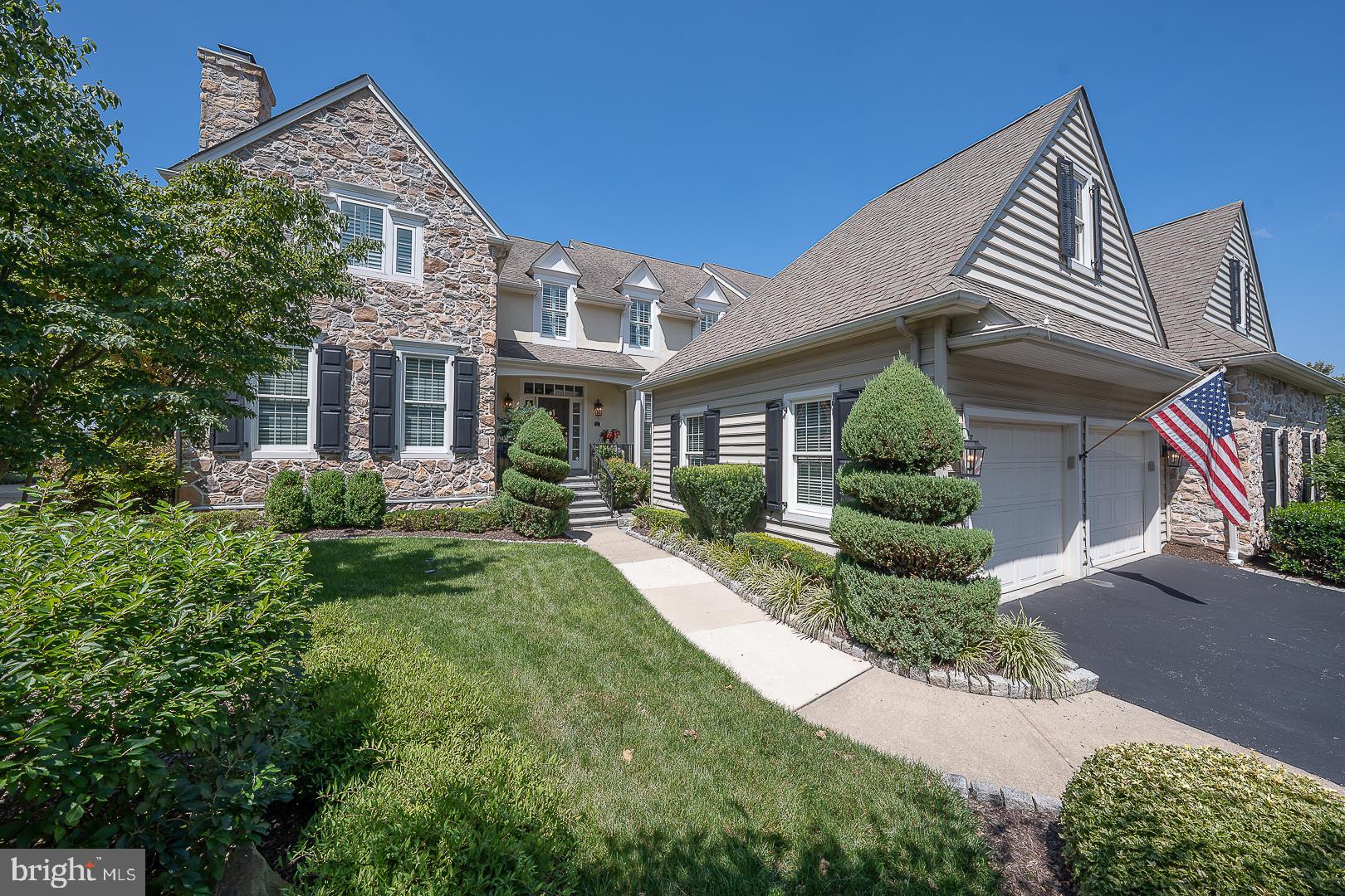 Discover unparalleled sophistication in one of a kind, exceptional 3-bedroom, 3.5-bath carriage home, ideally situated on the 17th green of the prestigious Applebrook Golf Club in East Goshen Township. Originally designed by and for the builder (Pohlig) himself, this custom residence is located in the highly sought-after Applebrook community and features the highest-quality materials, superior craftsmanship, and an elevated trim package throughout. Approach this inviting home through a private, beautifully landscaped entrance featuring a charming front door and a peaceful side landing with a bench.  From the moment you step into the grand foyer, you'll be captivated by the gleaming hardwood floors, intricate crown molding, and sweeping staircase that set the tone for timeless elegance. The formal living room impresses with a striking gas fireplace framed by floor-to-ceiling millwork, while a private study with custom built-ins and recessed lighting offers a refined space to work from home or read. A stylish formal powder room and coat closet for guests sits conveniently as you enter the main living areas. Designed for both luxurious daily living and exceptional entertaining, the sun-filled family room boasts a coffered ceiling, surround sound system, gas fireplace, hidden storage within custom cabinetry, and a wall of French doors that frame breathtaking views of the golf course. The chef’s kitchen is a showpiece, equipped with a 6-burner gas cooktop, double ovens, granite countertops, paneled Sub-Zero refrigerator, oversized island, and built-in secretary’s desk. A bright and airy breakfast room provides panoramic views, while the formal dining room dazzles with refined millwork. The adjoining bar area is equipped with glass cabinets and a wine fridge for effortless entertaining. A spacious mudroom off the two-car garage completes the main level with functionality and style. Upstairs, the elegant primary suite offers a tranquil retreat, featuring tray ceilings, dual walk-in closets, and a spa-inspired ensuite with soaking tub, oversized tile shower, heated floors and dual vanities. Two additional bedrooms with generous closet space share a Jack-and-Jill bath with separate vanities, glass enclosed shower and a skylight, while a large laundry room and an additional office or optional fourth bedroom with gas fireplace offer versatility for modern living. The fully finished lower level extends the home’s exceptional living space and is thoughtfully designed for both relaxation and entertaining. It features a full wet bar complete with an ice maker and beverage center, a custom wine cellar, and a comfortable lounge area perfect for movie nights or casual gatherings. A spacious recreation area with a pool table, a full bath, sauna, and a home gym, easily adaptable as additional office space, adds to the versatility of the space. Ample storage is also available throughout, ensuring both form and function are effortlessly maintained.  Step outside to a beautifully landscaped flagstone terrace, featuring a pergola, built-in gas grill, stone fire pit and surrounding wall, and retractable awning perfect for year-round entertaining or simply enjoying the serenity of the golf course and captivating sunsets. This sun-drenched, custom-designed home also includes a full home generator, ensuring uninterrupted comfort and security no matter the weather. Ideally located just minutes from the shops and dining of Malvern, East Goshen Park, Willisbrook Preserve, and Philadelphia’s Main Line, 337 Applebrook Drive offers the pinnacle of luxury living in an unmatched location. This sun-drenched, custom-designed home is an extraordinary opportunity not to be missed.