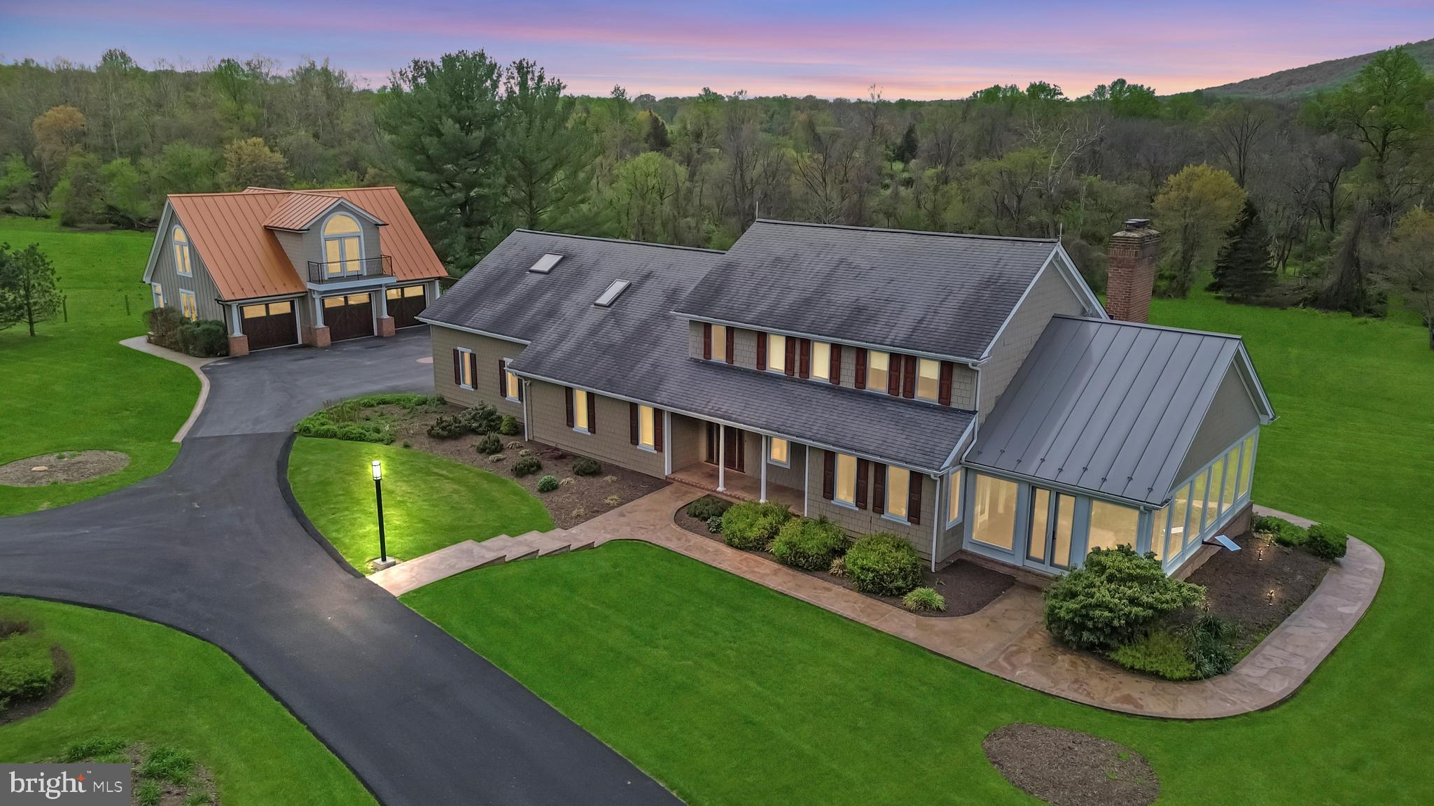 This is the first time this amazing property is on the market! Don't miss this great opportunity. This beautiful Southern Frederick County estate sits on 29.7 acres of land and offers stunning views of Sugarloaf Mountain! The property is located on the border of Thurston and Sugarloaf Mountain Roads and features two spring-fed streams and a stocked pond. Access to the Sugarloaf Trails is also easy from this location, making it an excellent option for outdoor enthusiasts.  The home has been thoughtfully updated and includes 4 bedrooms, 5 ½ baths, and a wide array of modern upgrades. 

Inside, you’ll find recently upgraded bathrooms with elegant Toto toilets and recently replaced sink faucets. Enjoy a recently added Starlink internet connection for fast, reliable service. The recently replaced Andersen and Marvin windows, Western Red Cedar ceilings, and extensive recessed/track LED lighting are just a few of the features that make this home truly unique. The property also boasts 6-zone heating and 3-zone cooling, geothermal heating/cooling with optional gas heat, and a condensing gas boiler. The updated kitchen includes granite counters and cherry cabinets. A glass porch with flat panel baseboard heating, a second-floor bedroom suite, and a sunroom with an in-floor 350-gallon spa are just a few more features that add to the home's appeal. The property also includes a 2 ½ car heated and cooled garage, a new 20KW whole house LP gas generator, and 1,000 and 500-gallon inter-connected LPG storage tanks. Recent updates also include an updated well pump and electronic subdrive. Hardie Shingle Siding and extensive Arizona Slate walkways complete the exterior of the home. In addition to the main house, there is a 3-bay garage-accessory structure with 800 SF of unfinished living space that features a recently added standing metal seam roof. This structure also has electric and water connections to the main house. Currently, the property is taxed under the Maryland Agricultural Use Program. The buyer will have the opportunity to continue with that program and keep these amazingly low taxes. This is a stunning property with a beautiful home and extensive outdoor amenities!