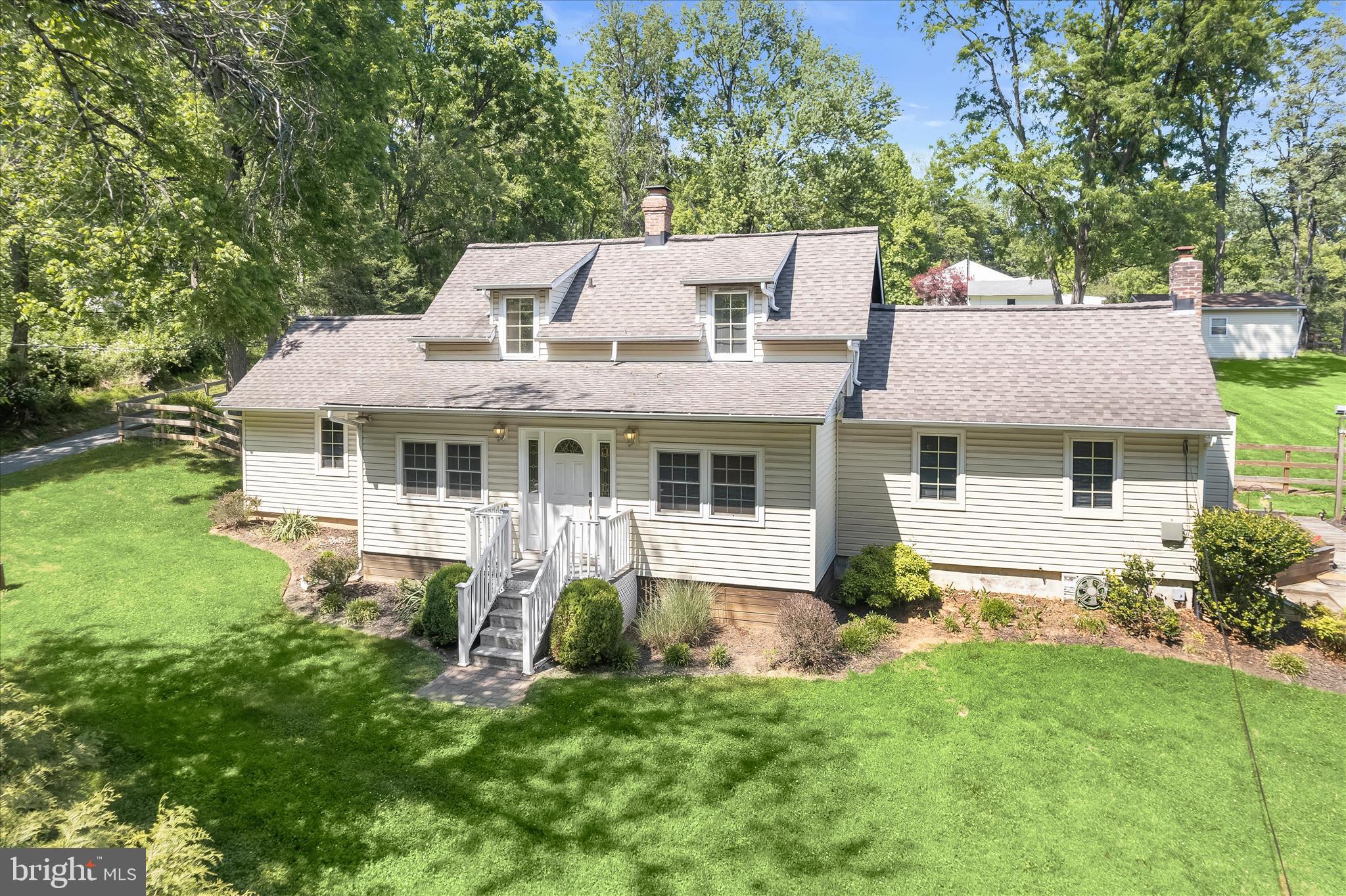 Spacious Cape Cod set on a premium .97-acre lot, offering privacy, charm, and thoughtful updates throughout. Improvements include new fencing, updated flooring, roof and siding (2005), septic pump line, and more. Enter through a versatile bonus room ideal as a sunroom or home office, opening to a bright, open-concept living and dining area. The home flows into a large family room with an en suite powder room and direct access to the expansive deck and backyard, perfect for everyday living and entertaining. The eat-in kitchen with breakfast area showcases a rustic exposed wood beam ceiling, adding warmth and character. A convenient entry-level primary bedroom suite features an attached full bath and walk-in closet. Upstairs, you’ll find two additional bedrooms and a full bathroom. The lower level offers endless potential and awaits your customization. Outdoors, enjoy the expansive deck overlooking the fenced, landscaped yard complete with a large storage shed equipped with electric and workbenches, ideal for hobbies or projects. Ideally located near major commuter routes, shopping, dining, and entertainment, this home combines space, comfort, and convenience in a picturesque setting.   (some photos have been virtually staged)