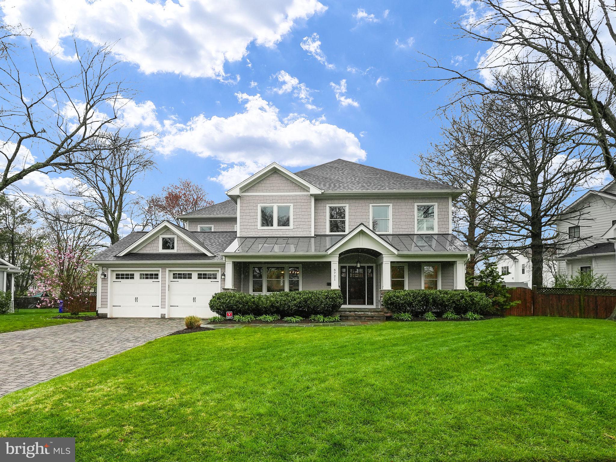 Welcome to 6721 31st Street N, built in 2017 by Classic Cottages.  This craftsman style luxury home features 6-bedroom, 4 full and 1 half bathroom residence is located in one of North Arlington’s most coveted neighborhoods of Berkshire Oakwood. This home is a rare find with a large, level rectangular lot – nearly a half-acre! 
 A welcoming flagstone path and large porch invite you into this exquisite home. Upon entry, you're greeted by a spacious foyer flanked by a bright sitting room boasting windows on two sides, and a dramatic dining room adorned with gorgeous wallpaper and a stunning chandelier. Entertain effortlessly with the butler's pantry, equipped with a beverage fridge and wine storage, adjacent to the kitchen.
The chef's kitchen is a culinary delight, featuring a marble backsplash, top-of-the-line Thermador stainless appliances, quartz counters, and an expansive quartz island with counter seating. There is full height, dual tone painted cabinetry, as well as a large pantry for extra storage.  The bright kitchen with pendant lights over looks the meticulously maintained backyard. The kitchen’s adjoining breakfast area has space for a full table, and adjacent to the kitchen is a large family room with a stone fireplace, built-in shelving, and coffered ceiling.  The access to the oversized all-season screen porch is off the family room, with a woodburning fireplace, IR heaters, and ceiling fans making it comfortable nearly year-round.  
A main level bedroom tucked away in the back corner provides a quiet retreat, with windows on two sides, built-ins and closet.  The two-car garage is oversized and conveniently enters into the mudroom for added convenience. The main level, stairways, and hallways have wood floors, while the bedrooms and basement are carpeted, and the entire home has LED recessed lighting.  
Upstairs, the primary suite is a sanctuary boasting ample natural light, dramatic window treatments, and a luxurious marble bathroom featuring dual vanities, a soaking tub and glass-enclosed shower, as well as two walk-in closets. Three additional bedrooms, one with a private en-suite bathroom, offer comfort and convenience for family and guests alike.  The upper level also includes a convenient laundry space with front-loading machines. 
The fully finished basement is an entertainer's dream, with a wet bar, large rec room, bedroom with a dual-entry bathroom, and a gym with mirrored walls and foam flooring.  There is walk-up access to the backyard as well.  
Step into your dream backyard oasis in the heart of Arlington, where nearly half an acre of lush greenery and meticulously landscaped grounds await. Fully fenced with a privacy fence, this expansive outdoor retreat offers the ultimate in privacy and tranquility. Host unforgettable gatherings in the outdoor kitchen, complete with a built-in grill and ample counter space for food preparation. Whether you're grilling up your favorite barbecue recipes or enjoying alfresco dining under the stars, this outdoor culinary space is sure to impress.
For the young ones, a charming playset beckons, providing endless hours of fun and adventure. Watch as laughter fills the air and imaginations run wild in this enchanting outdoor playground.
As the sun sets, gather around the cozy flagstone patio, perfect for conversations or simply enjoying the company of loved ones. With plenty of space for seating and relaxation, this outdoor sanctuary is an idyllic setting for making cherished memories year-round.
Whether you're seeking a peaceful retreat or an entertainer's paradise, this spectacular backyard offers it all. Escape the hustle and bustle of city life and immerse yourself in the serenity of nature right outside your doorstep. Welcome home to your own private slice of paradise in Arlington.