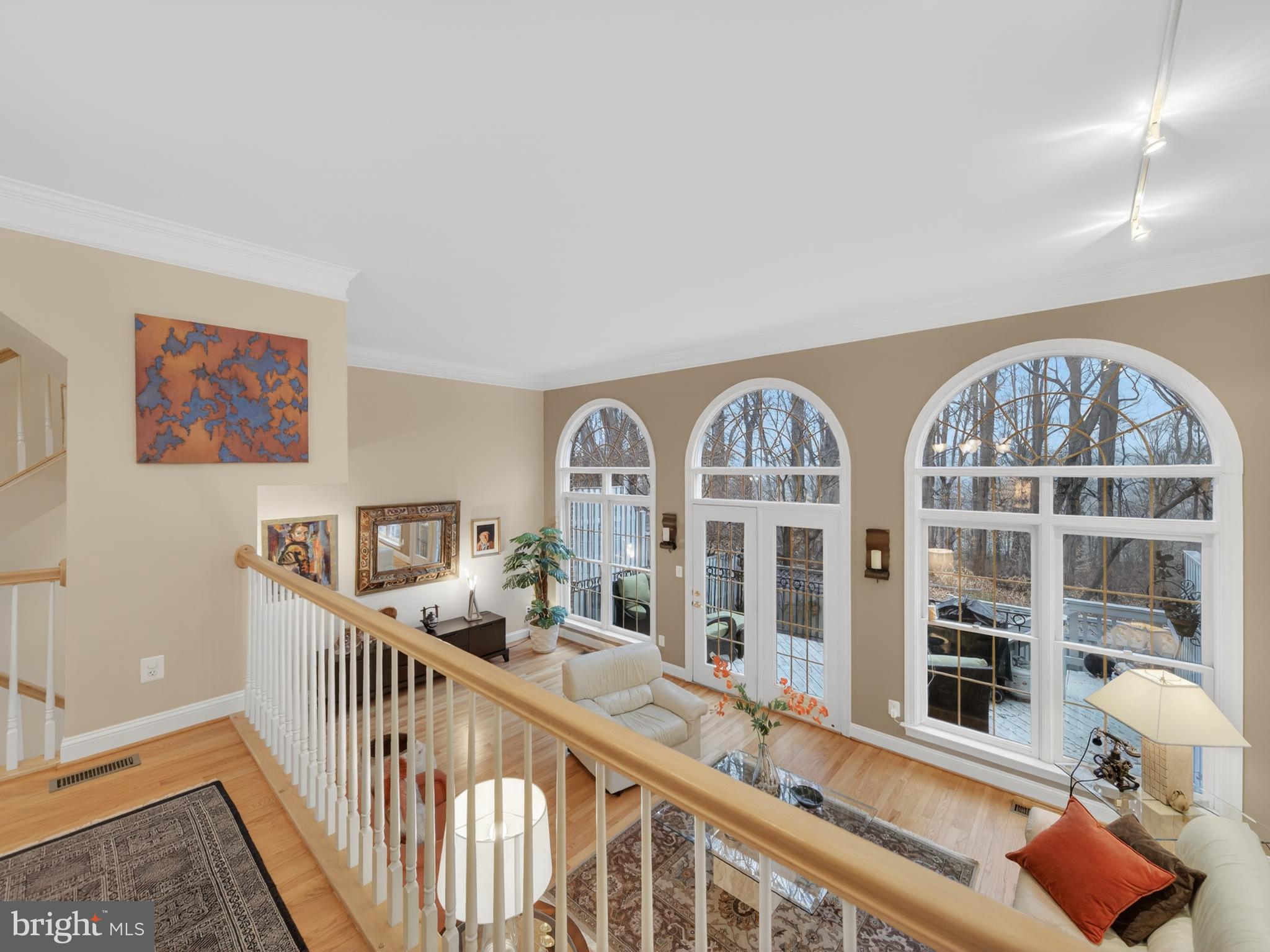 Nestled in the prestigious Palisades Park, this exquisite townhouse embodies luxury and comfort. The elegant Federal architectural style is complemented by a stunning brick veneer exterior, creating a timeless appeal. Step inside to discover a thoughtfully designed traditional floor plan, featuring a cozy breakfast area and a spacious dining area, perfect for entertaining. Natural light floods the home through beautiful Palladian windows and skylights, enhancing the inviting atmosphere. The fully finished basement offers additional living space, while the charming fireplace serves as a focal point for relaxation. Outside, enjoy serene moments on the deck or patio, surrounded by lush trees and parkland views that provide a picturesque backdrop. With an attached two-car garage and ample storage, convenience is at your fingertips. Experience the exclusive lifestyle this property offers, where every detail has been curated for comfort and elegance. Embrace the tranquility of scenic vistas and the vibrant energy of city life, all from your own private retreat.