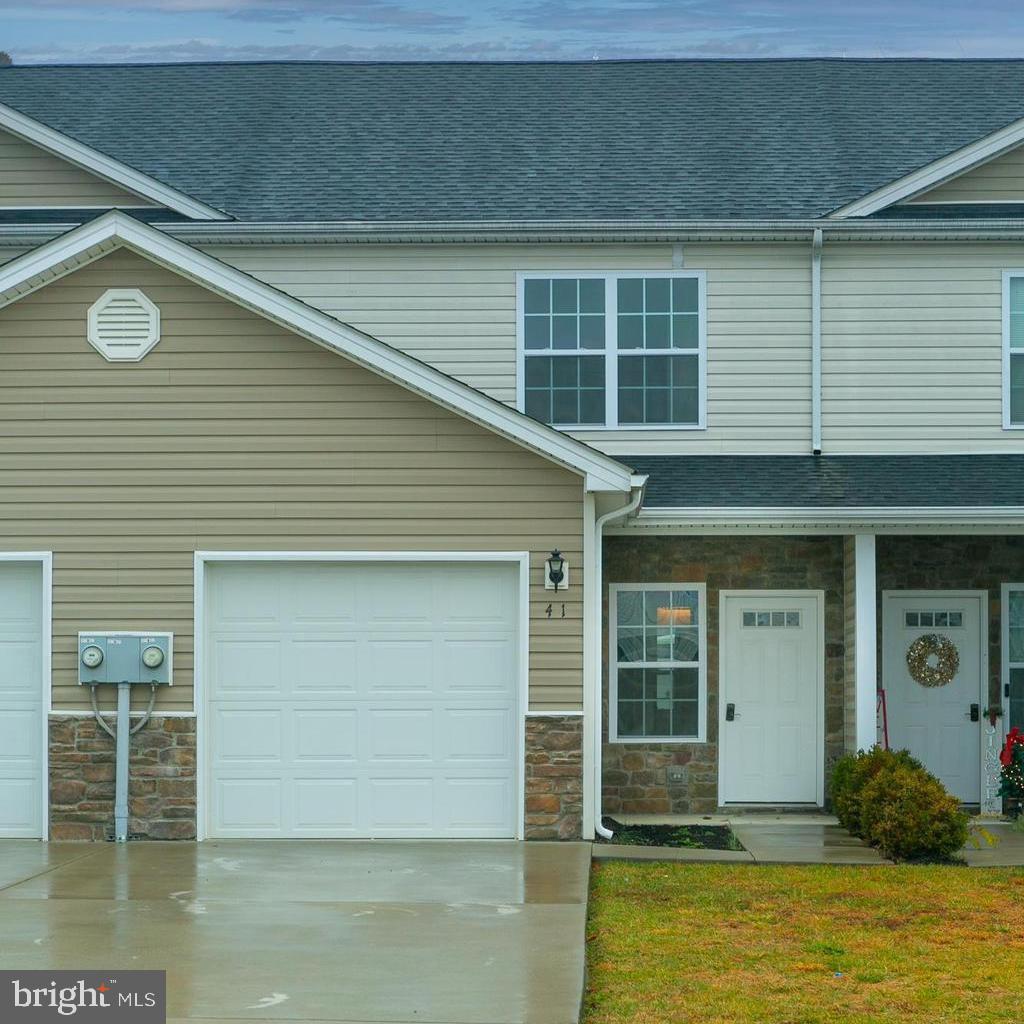 Modern townhome is move-in ready w/ fresh paint throughout!  Laminate flooring.  The inviting open floor plan flows from the covered front porch entrance through the loving room passes the half bath, walk-in pantry to the eating area off the updated kitchen, and through to the private fenced rear yard with concrete patio.  Kitchen features granite counter tops, plenty of dark easy-care cabinetry and black appliances.  Upstairs flows to all of the bedrooms offering vaulted ceilings.  Primary bedroom suite has private bath,  Bedrooms two and three share a full bathroom.  Convenient upper level hall laundry closet completes the upper level.  Moving in ready and offering everything you need for comfortable and convenient living located just minutes to I-81 and VA line!