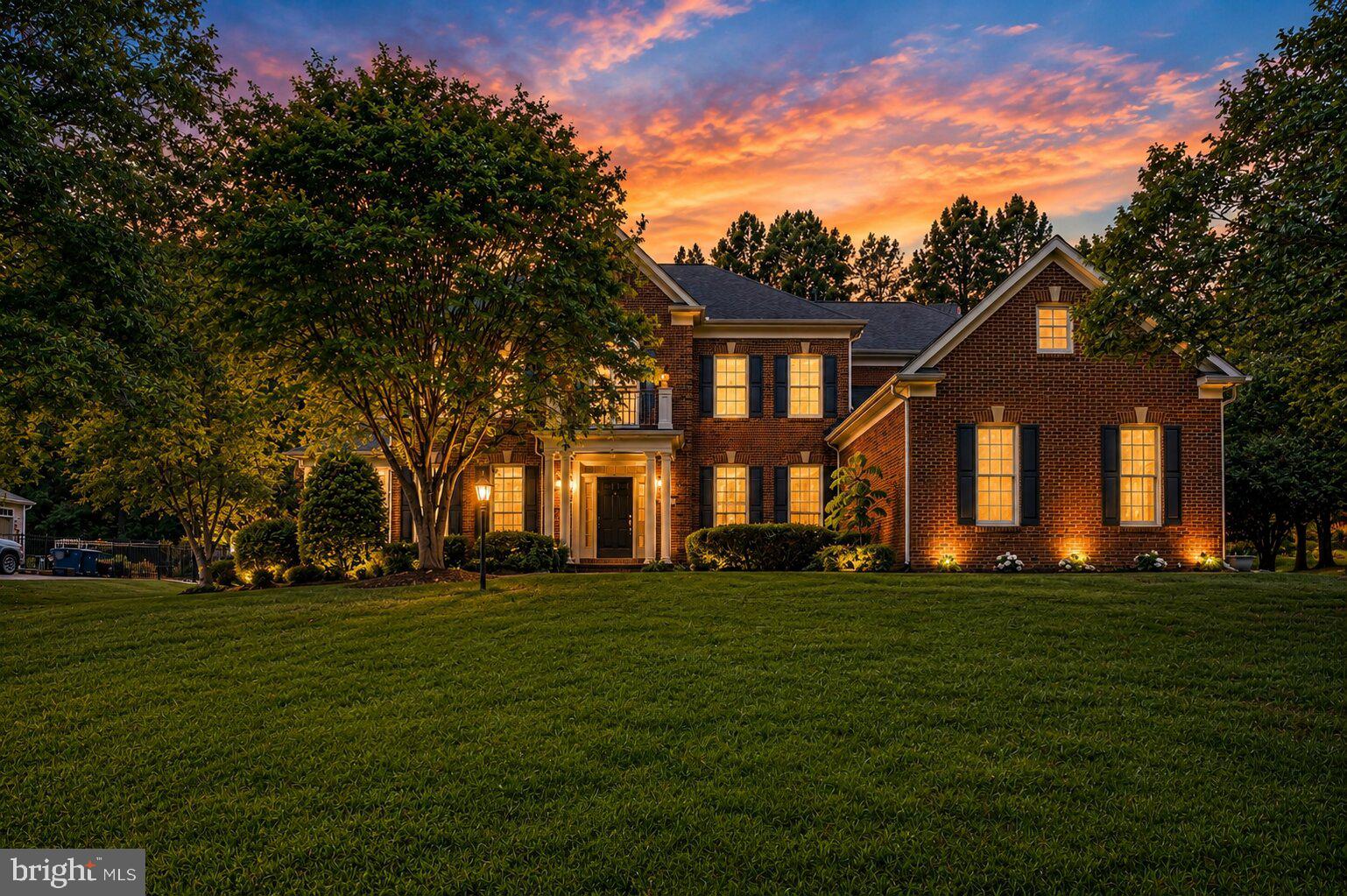 Immaculately built and beautifully maintained, this exceptional home offers an elegant blend of space, comfort, and thoughtful updates set on a private, landscaped lot designed for everyday living and memorable entertaining.

Step inside to a two-story foyer and an open, contemporary main level highlighted by hardwood floors. A bright sunroom with vaulted ceilings, ceiling fan, and abundant windows is perfect for plant lovers or a peaceful reading retreat. A private den/office with French doors makes working from home effortless, and a convenient powder room completes the main level.

The inviting t.v. room features a vaulted ceiling, plush carpet, and a gas fireplace, with windows and direct access to the deck for seamless indoor/outdoor living.

At the heart of the home is the updated kitchen. Well-appointed with granite countertops, a center island, double ovens, a dedicated microwave nook, and an oversized walk-in pantry with extensive shelving. A butler’s pantry adds additional storage and serving space. Enjoy backyard views from the kitchen window with automatic blinds, plus convenient access to the garage and laundry area. The eat-in space is accented by a statement chandelier, and the sun-filled breakfast area (Florida room-style) opens to the deck and backyard.

Formal spaces include a separate living room with wainscoting and chair rail, and a dining room with chandelier and decorative ceiling medallions, ideal for entertaining.

The three-car garage offers abundant storage and includes an EV charger (extra refrigerator in garage approx. 3 years old).

Upstairs, the luxurious primary suite impresses with a vaulted/coffered ceiling and ceiling fan, a private sitting room with gas fireplace, and a coffee station/wet bar with sink and mini-fridge area. The spa-inspired primary bath includes a soaking tub, walk-in shower, and two walk-in closets. Three additional bedrooms provide excellent closet space, one of the bedoroms with a private en-suite, plus a beautifully finished hall bath with dual vanities, honeycomb tile flooring, and a walk-in shower.

The lower level is an entertainer’s dream with a private media room (projector approx. 3 years old) and speakers, a recreation space/art room with built-ins, workout area or additional living space, guest/bonus room, full bath, and a mini bar with a large wine fridge. A private exterior entrance and abundant storage add convenience and flexibility.

Outside, enjoy a fully fenced backyard with a composite bin, mature trees, and a thoughtfully designed setting for relaxing or hosting: grill on the deck, unwind on the paver patio with pergola, gather around the fire pit, and enjoy the tranquil water feature/pond. The rear yard includes a playground area (to convey) with engineered wood fiber mulch. An underground irrigation system supports the lush landscape.. And no HOA. 
Buyer to verify dates:
Roof: 2015
HVAC: 2018
Water Heater: 2023
Dishwasher: 2023
Washer/Dryer: 2023
Outdoor improvements included a premium aluminum fence installed by NOVA Fence, a backyard playground area, improved landscaping throughout the property.
Kitchen upgrades included the installation of an island vent hood and an electric blind, along with replacement of the dishwasher. A new LG washer-dryer unit for the laundry.
The living area was updated with modified wood cabinetry to accommodate a larger TV.
New King mattress with electric adjustable base.
All five bathrooms were upgraded with the addition of bidet sprayers.
Basement upgrades included new carpeting (for main area) and replacement of the water heater. Additional interior enhancements included updated paint in select areas. Media room upgrades included a new projector and main speaker.
Garage upgrades include blinds and smart garage
About $70,000 in recent home improvements, upgrades, and enhancements. Furniture, including  a Baker dining set (originally purchased $20k), will be included at no additional cost with an acceptable offer.
