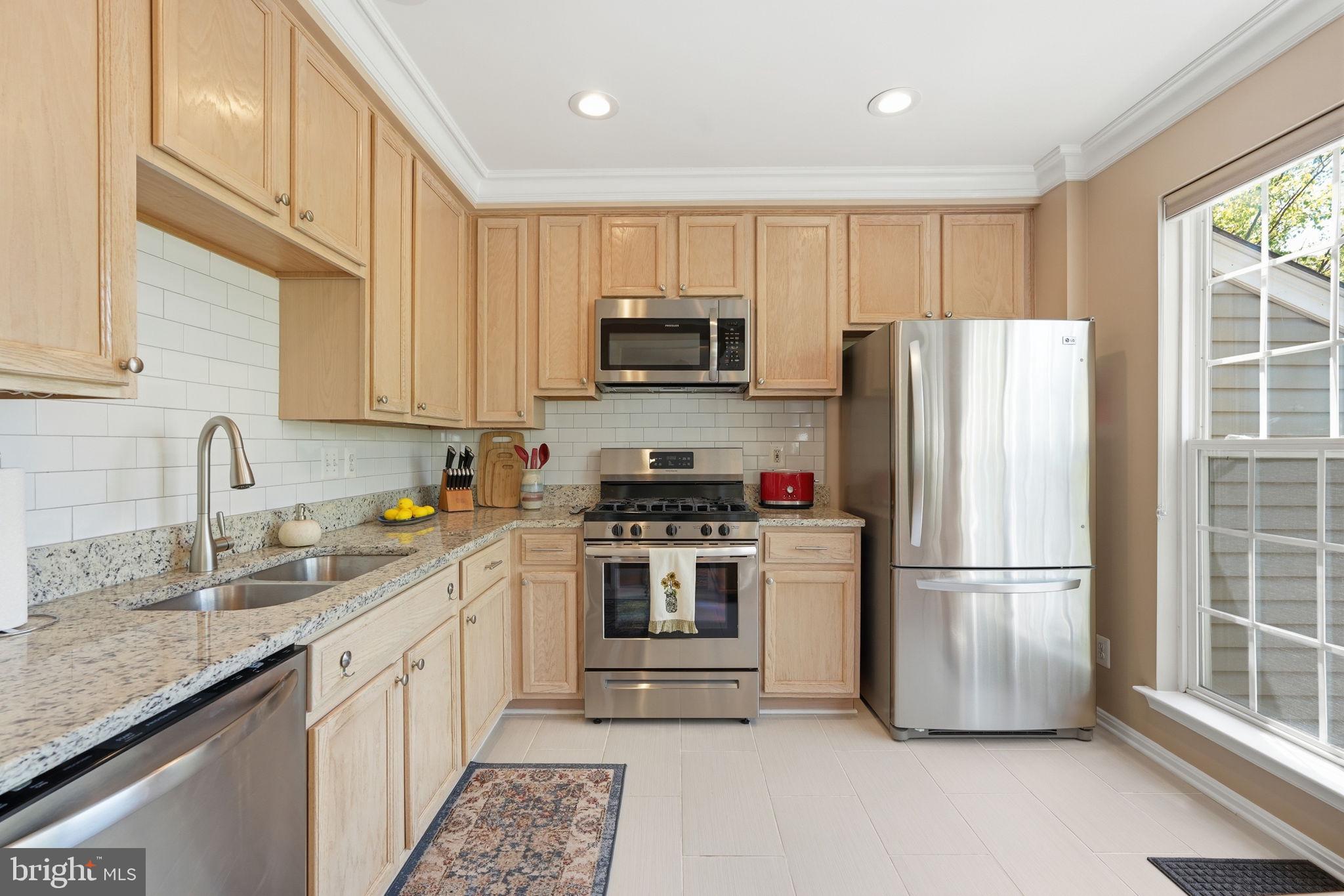 Welcome to this sun-drenched, meticulously maintained two-level luxury condo in the highly sought-after Fallsgrove community! Flooded with natural light from its premier sunny exposure, this home perfectly blends modern elegance with effortless living.
The main level features a spacious, open-concept living and family room area that flows seamlessly onto a private balcony, ideal for your morning coffee or evening relaxation. A beautifully appointed kitchen and a convenient powder room complete this inviting lower level.
Upstairs, retreat to the quiet privacy of two expansive bedroom suites. The grand primary bedroom features a private bathroom and generous closet space, while the equally impressive second en-suite bedroom boasts its own full bath and an enviable walk-in closet. For ultimate convenience, the upper level also hosts a dedicated laundry and storage room.
Kept in pristine, turnkey condition by its meticulous owners, this stunning home is completely move-in ready. Enjoy an unbeatable location just steps from the Fallsgrove Village Center shopping, scenic walking paths, Shady Grove Medical Center, and major commuter routes including I-270. Don't miss this gem!