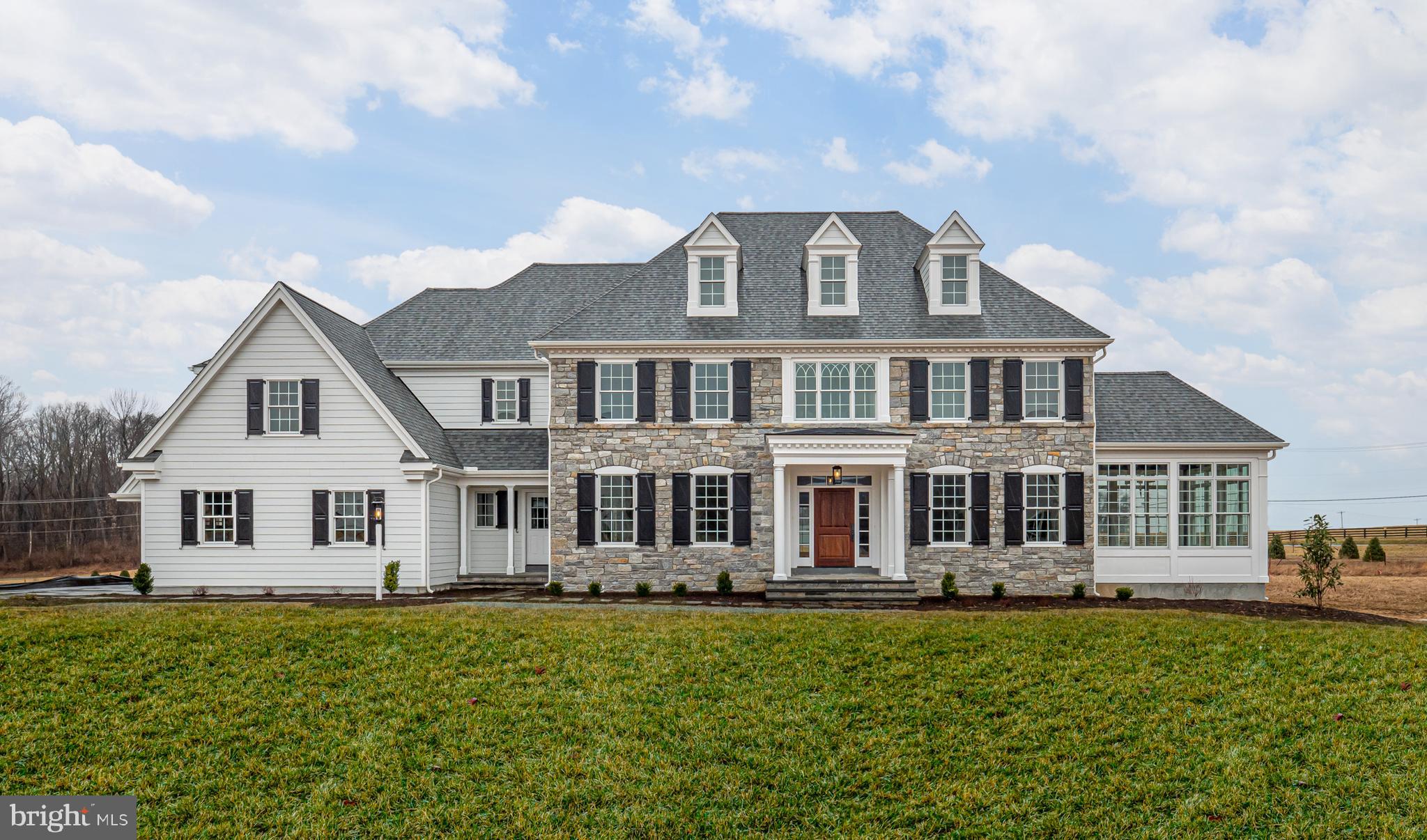 Set high above the valley in the heart of Malvern, The Estates at Howell Ridge offers a rare opportunity to build a custom luxury home on a breathtaking 4.9 acre homesite with sweeping panoramic views. Combining privacy, timeless architecture, and an exceptional location, this premier offering is just minutes from Route 202, the Pennsylvania Turnpike, Great Valley Corporate Center, upscale shopping, dining, and award-winning Great Valley schools.
Crafted by Hellings Builders, one of Chester County’s most respected custom builders, buyers will work directly with the builder and architect to personalize every aspect of the home—from floor plan adjustments and architectural details to finishes and design selections—creating a truly one-of-a-kind residence tailored to their lifestyle. Buyers may customize the featured Conestoga Model, collaborate on a fully custom design, or bring their own plans to create a home uniquely suited to their vision.
The featured Conestoga Model showcases classic design, elegant proportions, and a layout created for both everyday living and entertaining. A dramatic front-to-back foyer welcomes you into the home, flanked by formal living and dining rooms that create a refined first impression. The gourmet kitchen flows seamlessly into the breakfast area and expansive family room, while thoughtful spaces including a private study, butler’s pantry, oversized mudroom, and dual powder rooms add both functionality and sophistication.
Upstairs, the luxurious owner’s suite serves as a private retreat with a tray ceiling, dressing area, dual walk-in closets, and spa-inspired bath. Secondary bedrooms are generously sized with well-designed en-suite and Jack-and-Jill bath layouts.
An exceptional custom home opportunity in one of Malvern’s most spectacular settings.
NOTE: THE PHOTOS SHOWN ARE OF A COMPLETED HOME AT A DIFFERENT LOCATION AND MAY INCLUDE OPTIONS, UPGRADES, AND ALTERATIONS NOT INCLUDED IN THE BASE PRICE. PLEASE CONTACT LISTING AGENT FOR DETAILS.