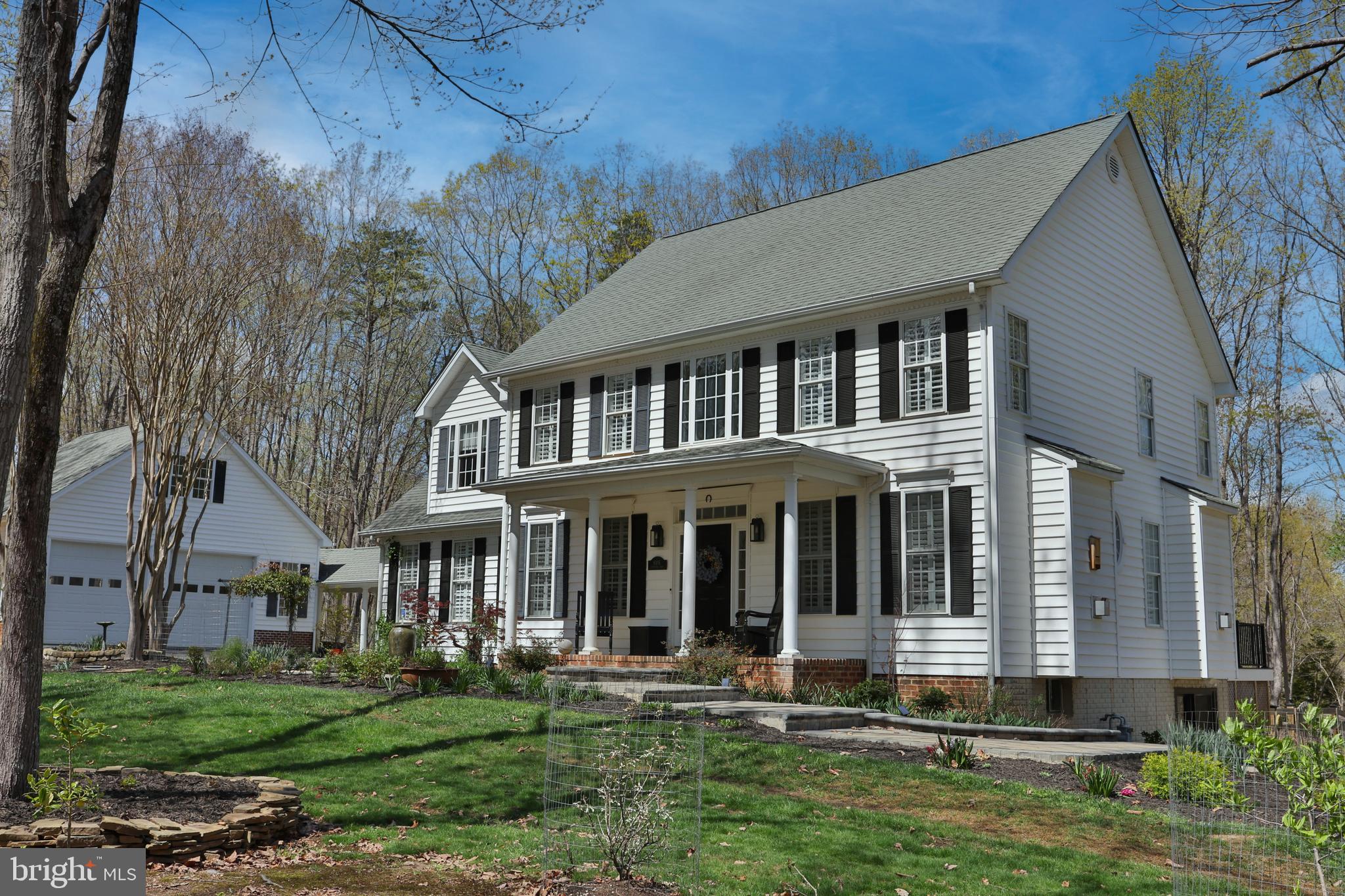 Welcome to this meticulously updated 4-bedroom, 2.5-bathroom colonial in the Estates of Chancellorsville, one of the Fredericksburg area's most bucolic and desired neighborhoods, that also boasts the top elementary, middle, and high school in the county. With over $150,000 in custom improvements since 2022, this home blends timeless design with custom craftsmanship and outdoor charm.  


From the moment you step inside, you’ll notice, and maybe even feel, the warmth of beautiful oak hardwood floors throughout the main level, and the abundance of natural light that gives the home a bright and airy feel. As you enter, behind elegant French doors, you’ll find a cozy sitting room with a gas fireplace—perfect as a relaxing reading nook or a private home office.

The heart of the home is the custom chef’s kitchen, outfitted with eye-catching granite countertops, an 8-burner commercial Forno natural gas stove, hand-made Moroccan Zellige tile backsplash and upgraded cabinetry that makes this space as functional as it is beautiful. There's a sunny breakfast area just off the kitchen that’s surrounded by windows and leads directly to the recently upgraded two-tone Trex deck, with sleek, low-profile railings, ideal for morning coffee or evening entertaining.

The expansive and open family room is light-filled and cozy, with its own natural gas fireplace, and is as comfortable as it looks.  

The upstairs primary suite is restful and enveloping, with deep, gray tones on the walls and ceiling, creating a sanctuary like atmosphere. The bathroom has been completely renovated with a sleek, window lit, soaking tub, marble tiled curbless shower, double vanity, exquisitely tiled floor, and Elfa closet system that adds both elegance and organization.

The basement includes 1,100 square feet of unfinished space, with rough-in plumbing for a full bath, HVAC in place, waiting for a new owner’s personal vision.

The outdoor areas and grounds are well designed, inviting, and simply beautiful. They include an elegant entrance way fountain and professionally hardscaped paver patio, walkway and steps, with the pavers laid over a poured concrete base. The fenced backyard is neatly manicured and pet friendly. It includes attractive and durable metal raised garden beds, perfect for a home chef’s herb/vegetable garden, or any plant lover’s wishes. 

The oversized, detached two-car garage, is connected to the home by a covered stamped concrete walkway with stately columns providing a bonus multi-purpose space while adding curb appeal. 

This property is absolutely stunning, and move-in ready. Come see it for yourself!