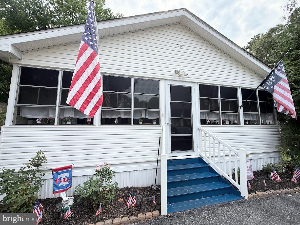 Welcome to your dream home in beautiful Pot-Nets Lakeside.  This well-maintained 3-bedroom 2-bath home is surrounded by lush landscaping and mature evergreens and is walking distance from the community’s large lake and boardwalk.  The property offers excellent accessibility with a ramp that ends on an outside deck large enough for grilling and enjoying the serene atmosphere.
Inside the home, you’ll find a spacious kitchen that flows seamlessly into the dining room and living room.  The primary suite offers a private retreat with an en-suite bathroom, while two additional bedrooms and a full bath provide comfortable accommodation for guests or family.  There is also a cozy nook or sitting room for reading or just relaxing.  The beautiful expansive enclosed porch on the front of the home is just waiting for you and your guests to enjoy after a long day.  The dedicated laundry room is a finishing touch for a home that is as efficient as welcoming.  This home is move-in ready and as a bonus, lot rent is paid through the end of the year.  
Pot-Nets Lakeside is amenity-rich with walking paths, gazebo areas, a community pool and is a short golf car ride to beaches in the neighboring Pot-Nets communities.  Even more exciting, the golf car is included in the sale of the home.