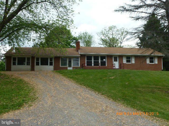 Large Rancher on private unrestricted lot.  Large main level family room connected to house by enclosed breezeway.  Mostly finished basement with second large family room.  Property being sold AS IS.