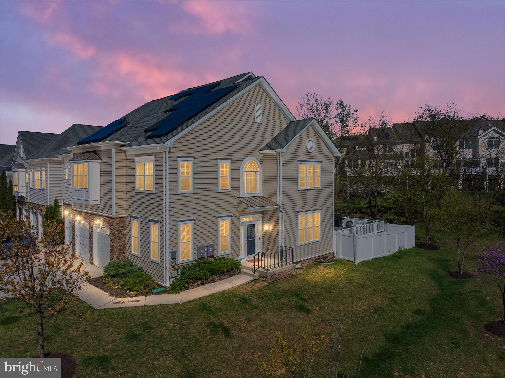 Welcome to the highly sought-after Stone Lake Community, a gated neighborhood with a 24/7 staffed security entrance and access to a beautiful private lake enjoyed year-round by residents.

This stunning End Unit Town house with 5-bedroom, 4.5-bath home offers spacious, thoughtfully designed living across three finished levels, enhanced by 10-foot ceilings throughout and an abundance of natural light that fills every room. The home has also been freshly painted throughout (2026), giving it a bright, modern feel. The upper level features four bedrooms, including a luxurious primary suite, while the finished basement includes a fifth bedroom with closet and egress window, perfect for guests or extended living.

The main level showcases updated 5” hickory hardwood floors, a bright and open layout, and a beautifully renovated kitchen. Enjoy white cabinetry, quartz countertops (2020), stylish backsplash (2020), and all-new stainless steel appliances (2026). The kitchen was thoughtfully opened by removing a wall, creating a seamless flow and adding a large center island with sink and seating—perfect for entertaining or casual dining—with additional space for a kitchen table.

Just off the kitchen, step down to a spacious pantry area that also provides convenient access to the garage and a main-level half bath. The family room with a cozy gas fireplace sits adjacent to the kitchen, creating the perfect gathering space.

Step outside to the low-maintenance deck, ideal for relaxing or entertaining, complete with a hot tub (2021), and enjoy the privacy of a vinyl-fenced backyard.

Upon entry, you’ll find a large, light-filled home office to the left and an elegant formal dining room to the right, featuring crown molding and chair rail detailing.

Upstairs, two bedrooms share a Jack-and-Jill bathroom, while another bedroom features its own private bath. The impressive primary suite boasts soaring ceilings, a spa-like en-suite bath, and an expansive walk-in closet that conveniently connects to the upstairs laundry room and hallway for easy access.

The fully finished basement offers a complete additional living space, including a bedroom, full bath, and flex area perfect for a gym, media room, or playroom.

This home combines comfort, style, and functionality in one of the area’s most desirable gated communities. Don’t miss your opportunity to enjoy lake living, privacy, and modern upgrades all in one exceptional property.