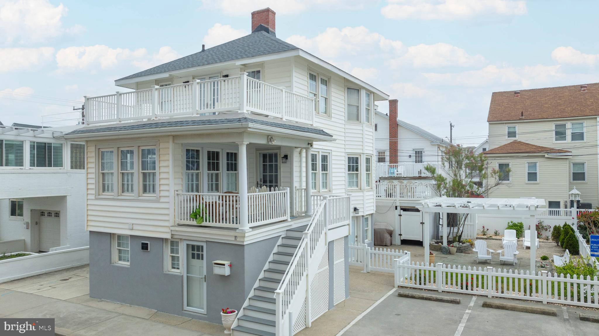 We are proud to offer an exceedingly rare opportunity to own an immaculate five
bedroom, 4.5 bath, three story home which has been lovingly restored to become a perfect blend of “old
Ocean City” but with the cleanliness and aesthetics of a brand new home, even having a super rare side
yard for entertaining and relaxing with the family/friends. Opportunities abound for this 3-properties-in-one house with two street level living quarters, each with one bedroom, full bath, living area, kitchen plus separate entrances located below the main home. The main home above is 3 bedrooms 2.5 baths. Possible uses include maintaining it as a single family home, renting all or some of the three units, or opening a bed and breakfast. Enjoy a 200 foot stroll to the HEART of the OCMD boardwalk, or a couple more steps to the ocean. Parking, which is in short supply in downtown OCMD is not a problem either, with parking for up to FOUR cars in available spots on both side of the house.