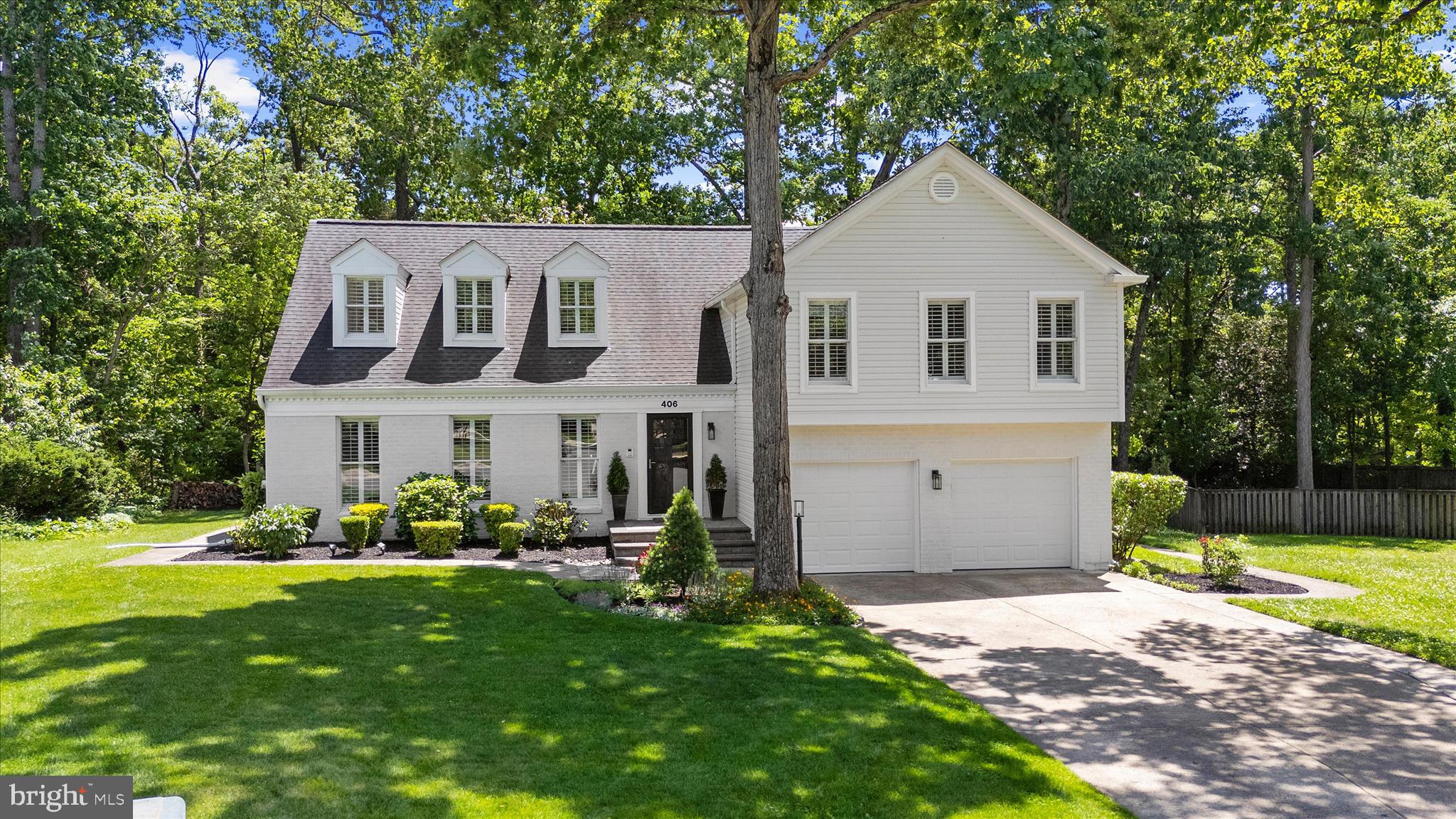 This updated colonial is tucked at the end of a cul-de-sac in Shipley’s Choice, set on a spacious, fenced lot backing to trees. An easy elegance defines this home, thoughtfully updated inside and out.

This modern take on a beloved classic floorplan includes an updated front walkway, vinyl siding (2025), and a full sprinkler system with front and rear zones. Inside feels fresh and bright thanks to numerous recent updates, including neutral paint, hardwood floors, wainscoting, new light fixtures, recessed lighting, and plantation shutters throughout the main level.

The kitchen opens to the main living area, where a brick fireplace with a pellet stove creates a warm, comfortable gathering space. Just off the living area, a flexible bonus room with its own wood stove offers options for a home office, den, playroom, or gym. The rebuilt screened porch extends the living space outdoors and overlooks the fully fenced backyard with a dedicated fire pit area and a peaceful treeline backdrop.

Upstairs, the primary suite offers a private retreat with a walk-in closet and a fully remodeled bath completed in 2025. Three additional bedrooms share a remodeled hall bath, and an upper-level laundry room makes everyday living easier! 

The lower level offers even more flexibility, with updated ceilings and added lighting that make it a great fit for a media room, gym, playroom, or hangout space. A large crawlspace provides plenty of extra storage. Major exterior updates add peace of mind, including recently redone roofing (2019 and 2025).

The neighborhood of Shipley’s Choice is beloved for its pool, tennis courts, playgrounds, trails, and strong sense of community. From 406 Honeywood Court, it’s an easy walk to Shipley’s Choice Elementary and the swim club, with quick access to I-97, BWI, Annapolis, Baltimore, and DC. Add in Severna Park schools, nearby shopping, dining, parks, and recreation, and this is a home that offers both comfort and connection. Welcome Home!