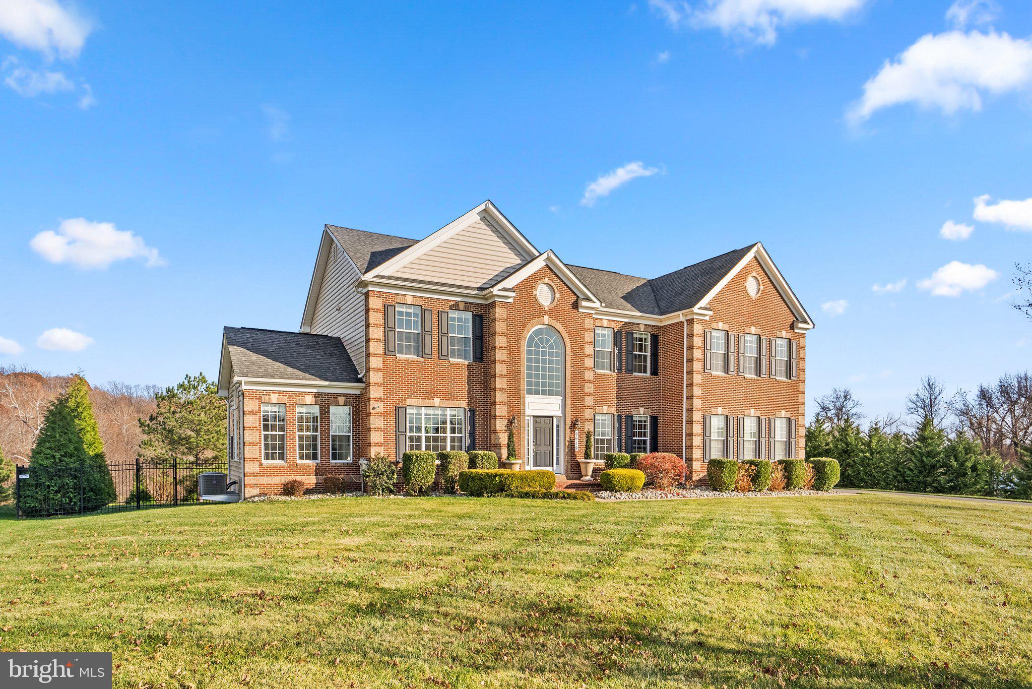 Welcome to a residence that epitomizes luxury and space! This exquisite 4-bedroom, 4.5-bathroom single-family home is gracefully situated on over an acre and a half of land in the esteemed Windsong community in Prince George County. Spanning an impressive 6,224 square feet, this meticulously designed residence offers a harmonious blend of opulence and functionality.

The thoughtful layout of this home provides not only generous living space but also a sense of tranquility within the private and fenced-in oasis that encompasses the outdoor surroundings. Entertaining becomes a seamless experience in the expansive living areas, soaring ceilings where the transition from indoors to outdoors enhances the overall entertainment atmosphere.

Every corner of this residence reflects attention to detail, with thoughtful renovations and an unmistakable touch of care. The kitchen, a focal point of the home, showcases quartz countertops with a prep sink, updated island lighting, and top-of-the-line appliances including 4 chef cooking stations with an 8-burner gas range plus two stacked ovens and a fume hood exhaust.

The flooring throughout the home tells a tale of warmth and sophistication, with brand new warm-toned flooring on the main level and cool-toned flooring in the basement. Molding details grace both the main and basement levels, adding a touch of elegance.

The lower level is a testament to both luxury and entertainment, featuring a finished basement with a full-size bar equipped with a fridge and freezer. A newly constructed billiard section and lounge area offer a perfect retreat for relaxation and socializing.

The outdoor space is a haven of privacy, enclosed by a complete backyard fence and enhanced by a backyard privacy green screen of Thuja green giants. Additional features include a wine cellar closet and an enclosed glass gym, creating a space for both indulgence and wellness.

This residence is not just a home; it's a masterpiece that invites you to experience the pinnacle of comfort, style, and modern living. Every detail reflects the dedication and love invested in creating a truly exceptional living environment.