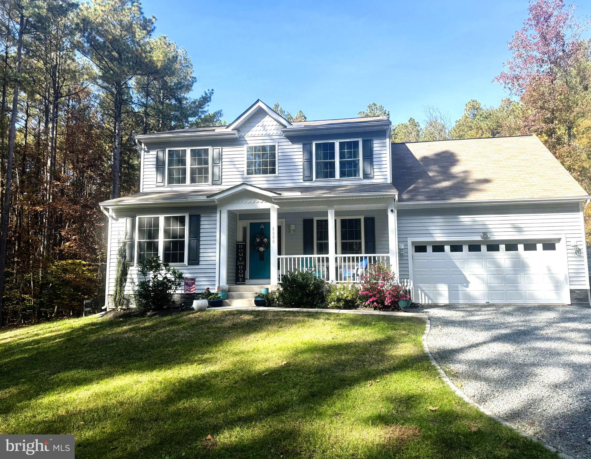 Price Improvement! Welcome Home to a beautiful custom built 4 bedroom , 4 Full Bath 3 Finished level home on a gorgeous and private 5.03 acres. You will love this secluded retreat offering both open and wooded land conveniently located about 1 mile to Lake Anna State Park. A tailored exterior , 2 car garage, front porch, and a 30' x 30' steel building with a 8 foot roll up door for plenty of outside storage.  A bright open 2-story foyer with hardwood style flooring leads into the living room with a gas fireplace. The kitchen has black stainless steel appliances, granite countertops and custom backsplash. A glass paned door leads to the deck,  concrete patio and fully fenced yard with plenty of room for grilling and entertaining. The walkout lower level has plenty of room for media, exercise room with plush carpeting and recessed lighting with a Full Bath. Home also offers a water softener/ionization system and a  Transfer Switch to run the electric in case of a power outage. If you are looking for a private oasis near Lake Anna with no HOA then this is a must see!