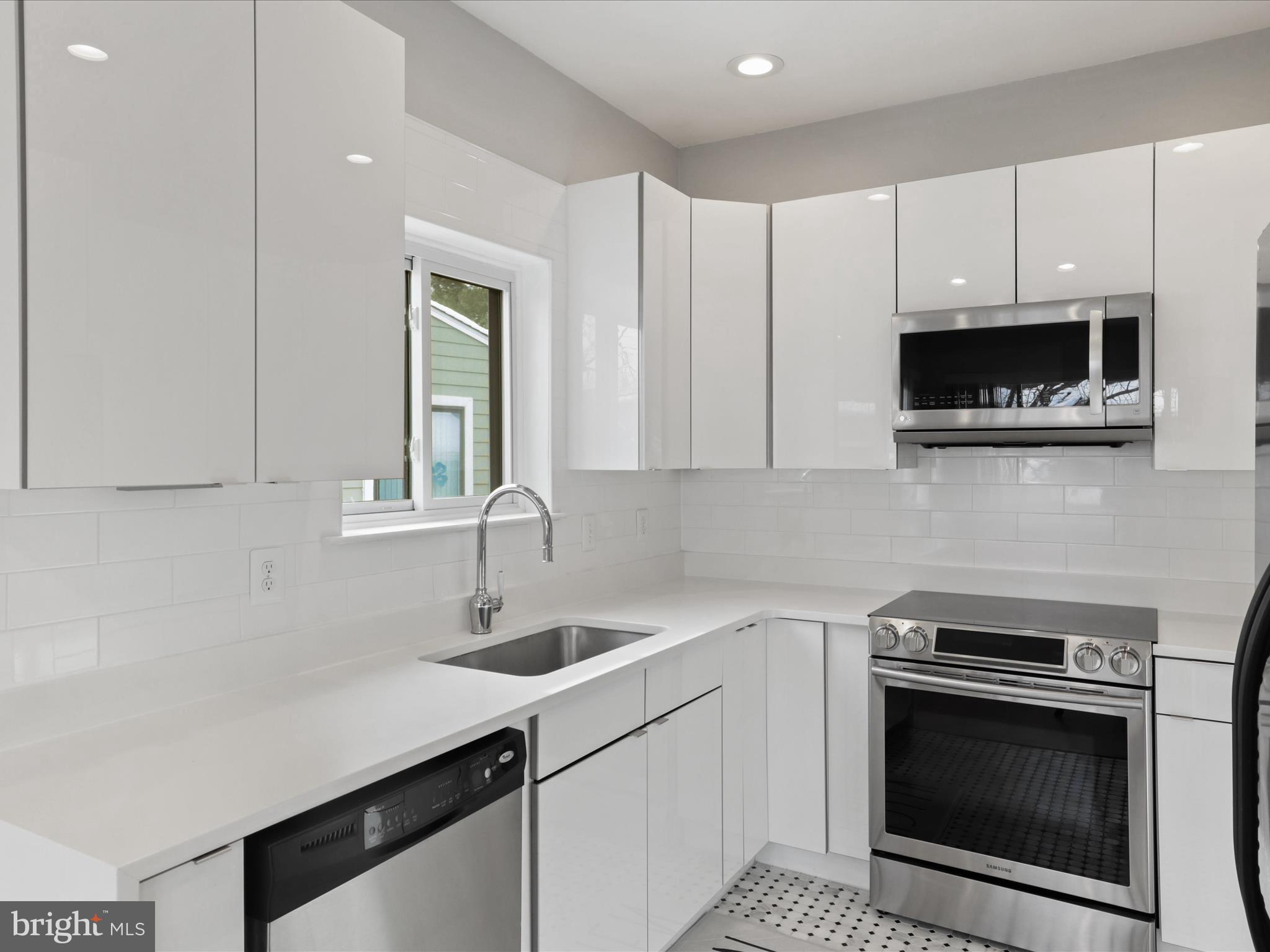One of, if not the most renovated Condos in Villaridge! Do not miss this Two Level, 2 Bedroom, 1 Bath Condo that sparkles. Walk in to Foyer with Storage Closet, Vaulted Ceilings and Skylights for ample lighting. Upstairs you are met with inviting Living/Dining Room Combo that includes Neutral Colored Flooring, Wood-burning Fireplace with Custom Granite Accent Wall, Dual Wall Efficient Windows and New Sliding Glass Door that all add bright natural light and lead to Private Patio for Outdoor Living. Condo includes additional skylights throughout, which is rare for the neighborhood.  Kitchen includes Basketweave style tile flooring, Quartz Counters, Subway Tile Backsplash, Stainless Appliances, 42" Cabinets and finally an Eat-In Breakfast area with custom wraparound bench for extra seating. Primary and Second Bedrooms share fully renovated Primary bathroom with tub/shower combo, tile flooring, custom vanity and custom subway tile throughout. Ample parking throughout neighborhood. Condo boasts privacy in a quiet location in the neighborhood,  is close to South Lakes Shopping Center and is within very close proximity to Wiehle Avenue Silver Line Metro by drive, public transportation or by foot ! Neighborhood is close to all attractions in Reston, including lakes, pools, tennis courts and the Reston Town Center. Available 1.26.24*