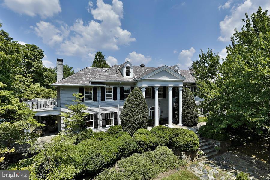 TREMENDOUS VALUE! PRICED TO SELL! Built in 1902, Boxwood is a stately center gable Colonial revival estate which features unmatched privacy by the soaring Maple trees, sprawling lawns & 1.25 acre (54,208 SF) of professionally maintained mature landscaping & hardscaping. 9,950+/-SF floorplan. Owner suite with 5 additional Bedrooms. Guest House. 4 Car Garage. Sport Court.