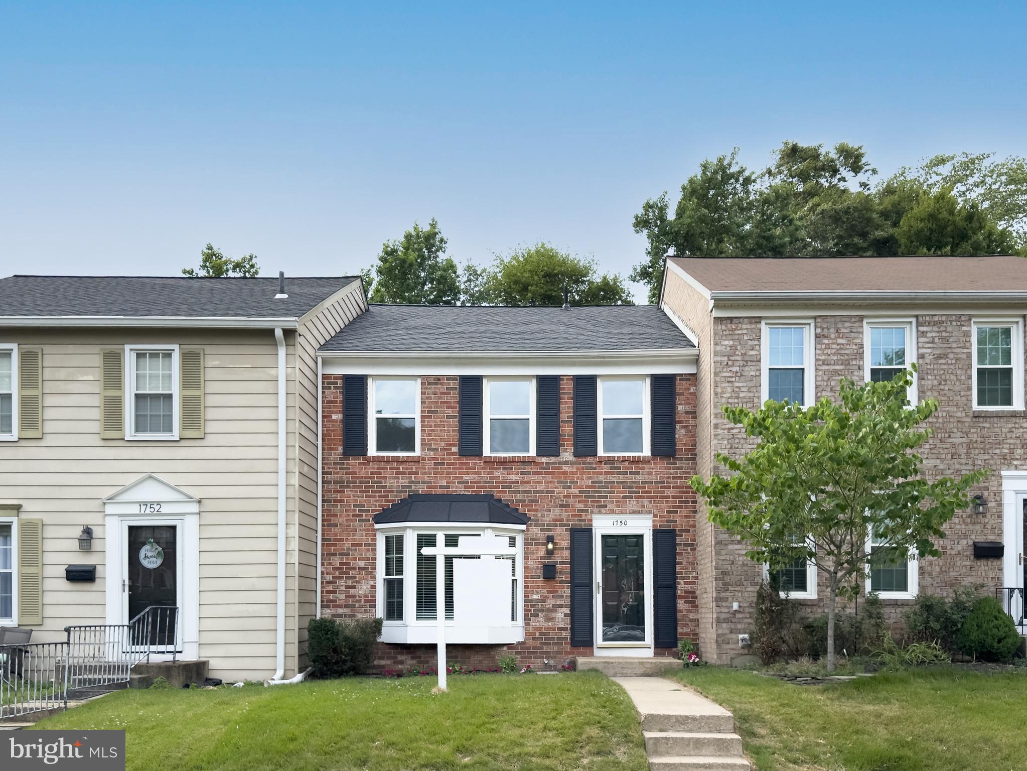 Beautifully updated townhome in the sought-after Crofton Commons community, conveniently located near the new Crofton High School! This move-in ready home offers stylish updates throughout, including luxury vinyl plank flooring on the main level, neutral paint, and an abundance of natural light. The welcoming living and dining room combination provides a comfortable space for everyday living and entertaining. The updated kitchen features crisp white cabinetry, unique granite countertops, stainless steel appliances, and a modern feel throughout. The finished lower level offers additional living space with a cozy electric fireplace featuring adjustable color settings, a beautifully updated full bathroom with walk-in shower, and walk-out access to the fenced backyard. Enjoy outdoor living with an updated deck and fencing already completed for you! Upstairs you will find three spacious bedrooms, including the primary bedroom with an updated en suite bathroom featuring a walk-in shower. The additional upper-level bathroom has also been transformed with a spa-inspired design and offers a tub and shower combination. With three finished levels, beautifully remodeled bathrooms, and a fantastic Crofton location close to shopping, restaurants, commuter routes, and community amenities, this home is one you will not want to miss!