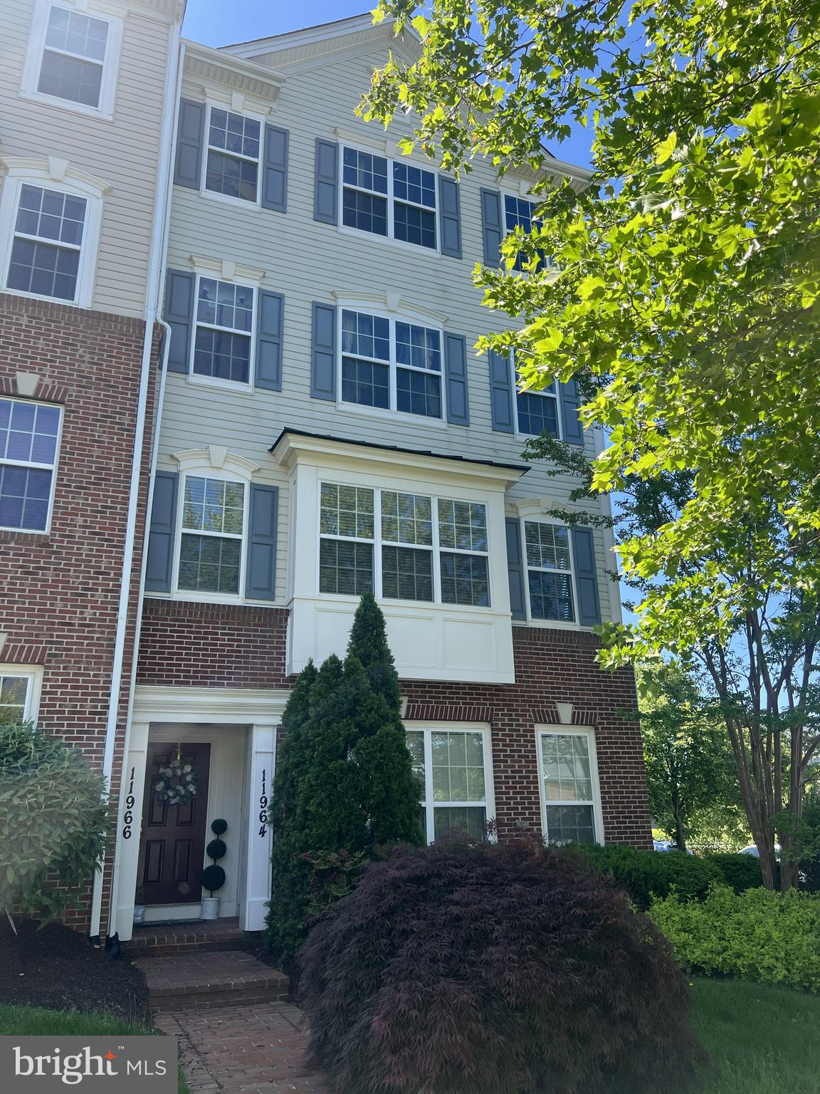 Welcome to this beautifully maintained end-unit condo townhouse in the highly desirable Arora Hills community! This bright and airy home offers an open-concept layout with abundant natural light, 2 spacious bedrooms, 2 full baths, 1 half bath, and an attached 1-car garage.

The main level features bamboo flooring, a spacious living and dining area, ceramic tile flooring in the kitchen, and a cozy electric fireplace that adds warmth and charm to the living space. Upstairs, you’ll find generously sized bedrooms plus a versatile loft area with balcony access — perfect for a home office, reading nook, exercise area, or additional lounge space.

The thoughtfully designed layout combines comfort and functionality, while the end-unit location provides extra windows and enhanced privacy. Enjoy all the amenities Arora Hills has to offer, including community pool, clubhouse, playgrounds, walking trails, and recreation facilities. Located within the sought-after Montgomery County Public Schools cluster.

Conveniently located near shopping, dining, parks, and major commuter routes including I-270, this home also offers easy access to multiple nearby bus routes connecting to Shady Grove Metro Station and surrounding areas, providing additional commuting flexibility throughout Montgomery County and the DC metro area.

Move-in ready and ideally situated in one of Clarksburg’s most desirable communities, this home offers both comfort and convenience in a prime location.