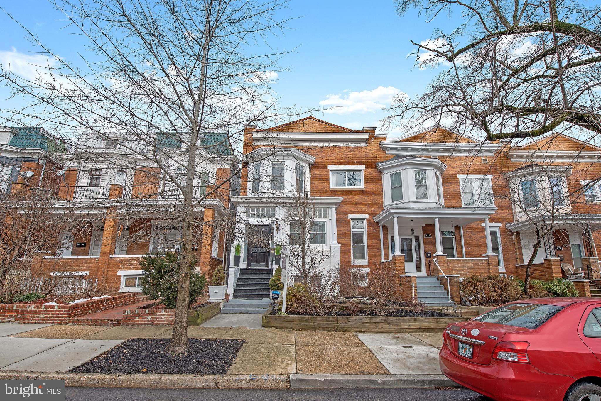 This completely updated, 25 foot wide home with garage parking is centrally located across from Druid Hill Park, which is home to the Maryland Zoo, and easy access to I-83 and the light rail. This home shows off its charm right as you walk in to the front sun porch. Hardwood floors throughout the main level, which features a living room, dining room, half bath, and kitchen. The updated kitchen has granite counters, white cabinets, stainless steel appliances, and tile floors. Upstairs has 4 bedrooms including a primary bedroom with an en-suite bathroom.  Rear bedroom has private balcony with views of the park! This lot is large enough to allow for green space and garage parking. Basement has finished space, complete with a full bath, as well as unfinished portion great for storage. Garage has power so it's great for a workshop space as well. Views of Druid Hill Park and the reservoir from the property really make this a unique, one of a kind home. Come see the best value in Rez Hill before it's done.
