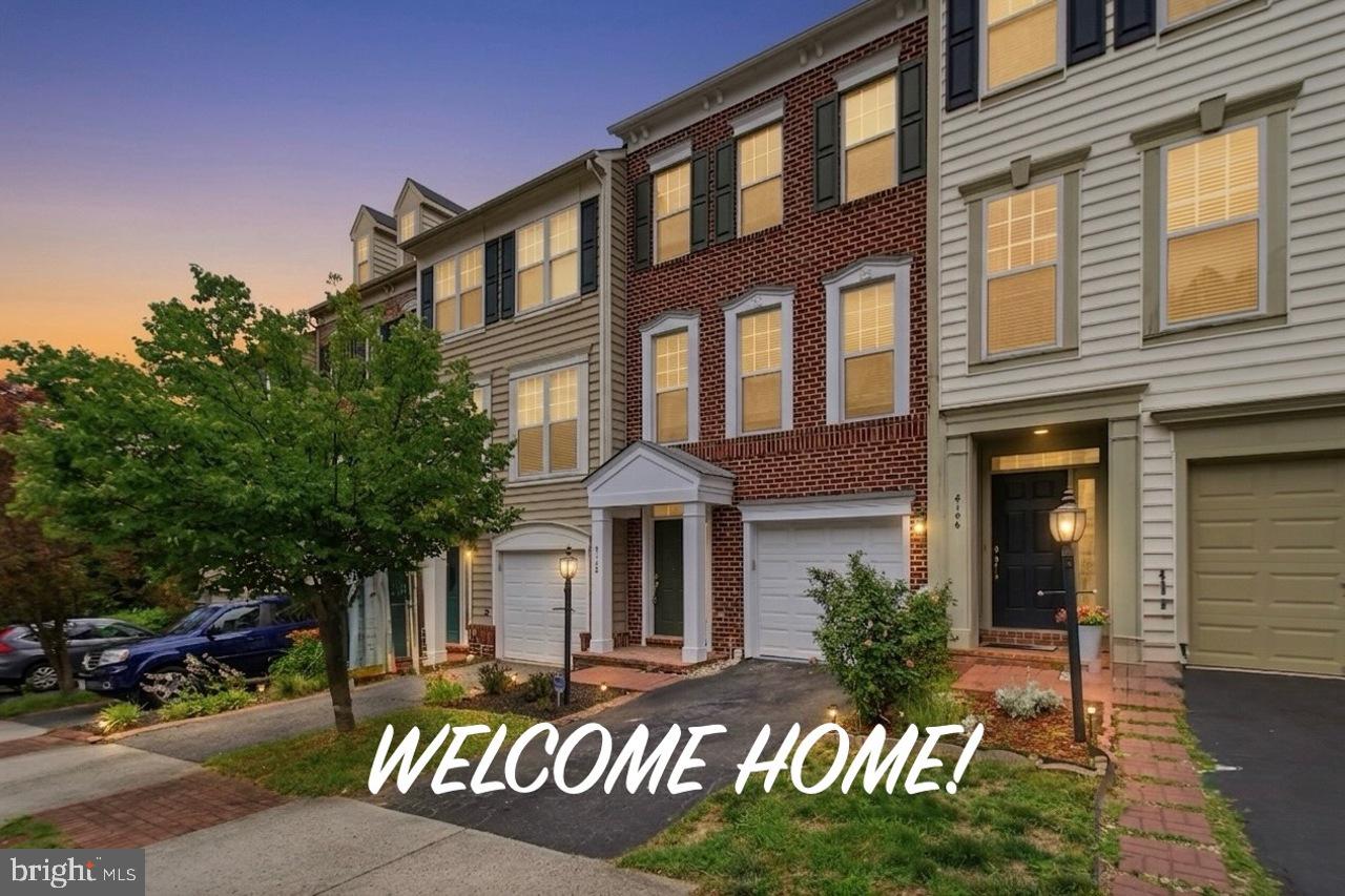 Welcome to this beautifully remodeled, turn-key brick-front townhouse in the highly sought-after Lorton Station South community! Spanning three fully finished levels, this light-filled home features an open-concept floor plan that has been freshly painted  and updated with -newer flooring throughout. The main level boasts an elegant country kitchen complete with a central island, granite countertops, a brand-newer gas cooktop, and a brand-newer dishwasher. The kitchen flows seamlessly into the dining and living areas, with direct access to an oversized rear deck—perfect for outdoor dining, entertaining, and summer BBQs. Upstairs, the spacious primary suite features dramatic vaulted and tray ceilings, a large walk-in closet, and a private ensuite bath with a dual-sink vanity. Two additional bright bedrooms and another well-appointed full bath complete the upper level, along with upper-level laundry hookups for ultimate convenience. The fully finished walk-out lower level offers a massive recreation room with a cozy fireplace, a third full bathroom, and effortless access to the patio and fenced-in backyard.  Park with ease in your 1-car attached front-entry garage. Enjoy incredible neighborhood amenities including a community pool, fitness center, clubhouse, tennis and basketball courts, and playgrounds—all within walking distance. A commuter's dream location, this home is approximately 1 mile to I-95, 2 miles to the Lorton VRE station, and just minutes from Route 1, Fort Belvoir, and local shopping centers. Truly a perfect blend of space, location, and move-in ready lifestyle!