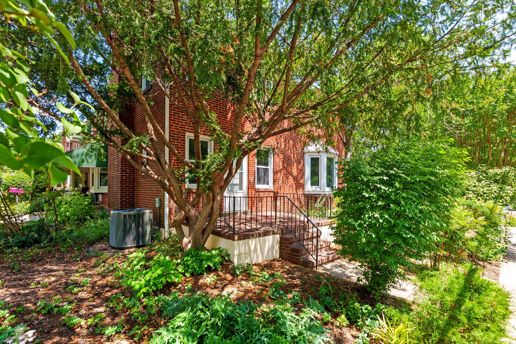 This charming 3 bed and 1.5 bathroom end-of-row townhouse in the desirable Carney/Cub Hill neighborhood offers a perfect blend of comfort and style. Built in 1952, this home features a warm brick exterior, living space with beautiful hardwood floors, a fireplace and ample natural light. The kitchen is equipped with stainless steel appliances, including a gas oven/range, convenient range hood, and refrigerator. A front-loading washer and gas dryer add to the home's modern conveniences. The upstairs bathroom a is fully tiled with a linen closet and shower/tub combination. The basement offers additional storage and versatility, with both interior access and an outside entrance. Outside, on-street parking provides convenience right next to the lovely shaded yard and shed. The seller is providing a one year home warranty to the buyer and the home is ready for your personal touches!