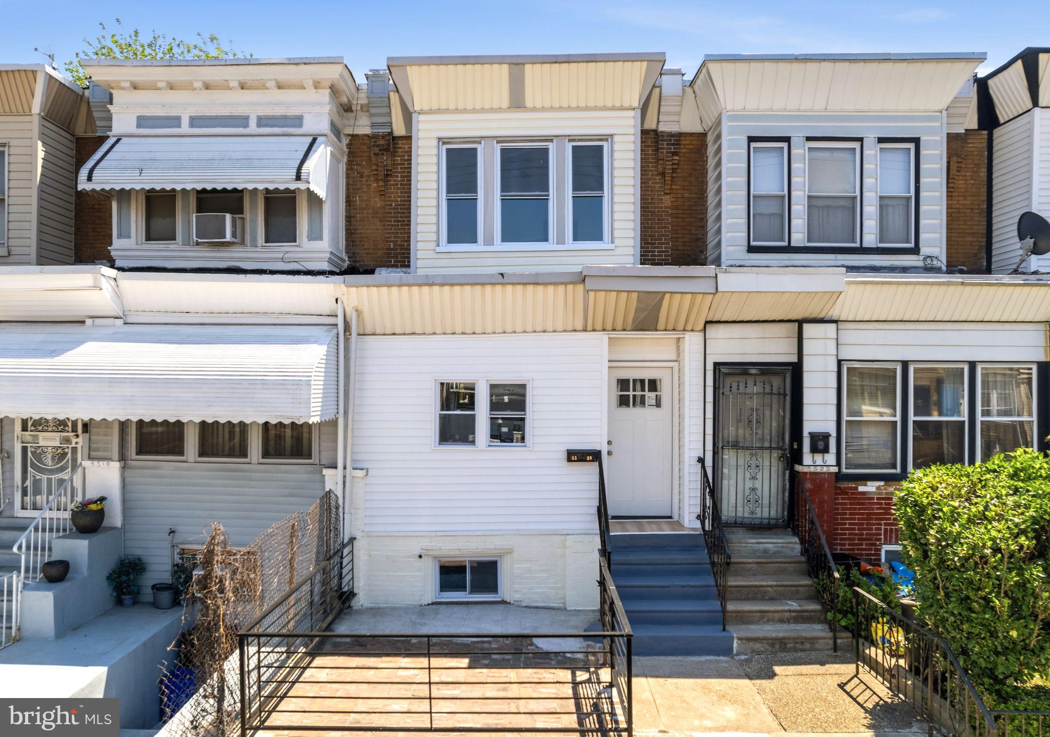 ***Qualified first-time buyers may be eligible for up to $5,000 in local grant assistance with local bank.***Tucked along a charming block in the growing Kingsessing section of West Philadelphia, 5520 Greenway Ave offers the perfect blend of character, modern updates, and functional living space. This beautifully updated 3-bedroom, 2-bath home welcomes you with a unique front stone patio, ideal for relaxing or entertaining guests outdoors. Step inside to find an enclosed front porch that adds valuable flex space — perfect for a home office, reading nook, mudroom, or play area. Beyond the entry, the home opens into a spacious open-concept living and dining area accented by warm-toned wood-look flooring that flows seamlessly throughout the main level, creating a bright and cohesive feel. The updated kitchen is thoughtfully designed with both style and practicality in mind, featuring granite countertops, stainless steel appliances, and abundant white wood cabinetry for ample storage and prep space. Just beyond the kitchen, a newer Trex deck creates the perfect setup for summer grilling, outdoor dining, and entertaining. Upstairs, you will find three sun-filled bedrooms with generous natural light and a centrally located full bathroom. The finished basement adds even more versatile living space and includes an additional full bathroom along with a dedicated laundry area, making it ideal for a guest suite, media room, gym, or home workspace. Major system upgrades have already been completed for added peace of mind, including newer windows, roof, HVAC system, water heater, and central air conditioning. Conveniently located near University City, Center City Philadelphia, public transportation, major commuter routes, shopping, dining, and neighborhood parks, this move-in-ready home offers excellent value for both homeowners and investors alike. Do not miss your opportunity to own an updated home in one of West Philadelphia’s steadily appreciating neighborhoods.