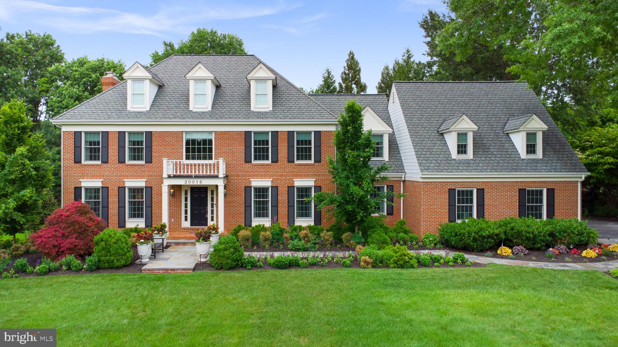 Impeccably maintained, extensively renovated, and thoughtfully curated for luxury everyday living, 20016 Belle Chase Drive presents a rare opportunity to own one of the most refined and turnkey homes in the highly sought-after Belle Chase community of Laytonsville.

Beautifully positioned on a lushly landscaped corner lot, this stately Colonial offers more than 6,000 square feet of finished living space and exceptional pride of ownership throughout. From the timeless exterior architecture and rare 3-car side-load garage to the thoughtfully selected interior finishes, every detail reflects quality craftsmanship, sophistication, and enduring design.

Between 2020 and 2026 alone, the owners invested more than $700,000 into transformative renovations and luxury lifestyle enhancements, including a spectacular custom pool and outdoor living environment, extensive landscaping and hardscaping, a fully reimagined designer kitchen, renovated baths, foyer renovation, premium appliances, upgraded systems, and cosmetic improvements. The result is an exceptionally turnkey property where buyers can immediately enjoy the lifestyle without the stress or expense of future renovations.

The stunning 2022 designer kitchen serves as the heart of the home, blending warmth and sophistication with custom cabinetry, expansive prep and entertaining areas, and curated luxury finishes. Premium appliances include Wolf double wall ovens, a Wolf steam oven, Wolf induction range, Cove dishwasher, Sub-Zero refrigerator, and refrigerator drawers, creating a truly elevated culinary experience. Adjacent gathering spaces are equally inviting, including the elegant family room featuring custom built-ins and a fireplace that anchors the room with warmth and architectural charm. A large, light-filled main-level office provides exceptional flexibility for today’s work-from-home lifestyle.

Designed with entertaining and relaxation in mind, the outdoor living experience rivals that of a boutique resort. The heated custom pool measures 40 feet by 18 feet and features premium Gunite and Pebble-Tech finishes for superior durability and longevity. The advanced mineral system uses significantly less chlorine than traditional pools, creating a more luxurious and low-maintenance swimming experience. Custom color-changing pool lighting transforms the backyard into a dramatic nighttime retreat. Expansive patios, lush landscaping, ambient lighting, and multiple gathering spaces create the ultimate private oasis. A covered outdoor dining pavilion and separate outdoor living room with stone fireplace provide effortless year-round enjoyment, while the expansive level lawn offers ideal space for recreation, sports, and gatherings.

The grounds feel like a private garden paradise thoughtfully cultivated over many years, with mature plantings, layered landscaping, exceptional attention to detail, and a charming garden shed that complements the property beautifully.

Additional recent improvements include the 2020 hall bath renovation, 2022 foyer tile renovation, 2023 laundry room and foyer bath renovations, upgraded flooring, HardiePlank siding, replacement windows, dual-zone HVAC systems, resurfaced driveway, smart home features, extensive built-in storage systems, and a fenced rear yard.

The fully finished lower level with full bath offers exceptional flexibility for recreation, fitness, media, guest accommodations, or extended family living. An unfinished attic extension, already insulated and pre-wired, presents valuable future expansion potential.

Belle Chase is admired for its established luxury setting, mature surroundings, and enduring neighborhood appeal, while offering convenient access to Laytonsville’s scenic countryside, golf, breweries, equestrian culture, preserved green space, and major commuter routes.