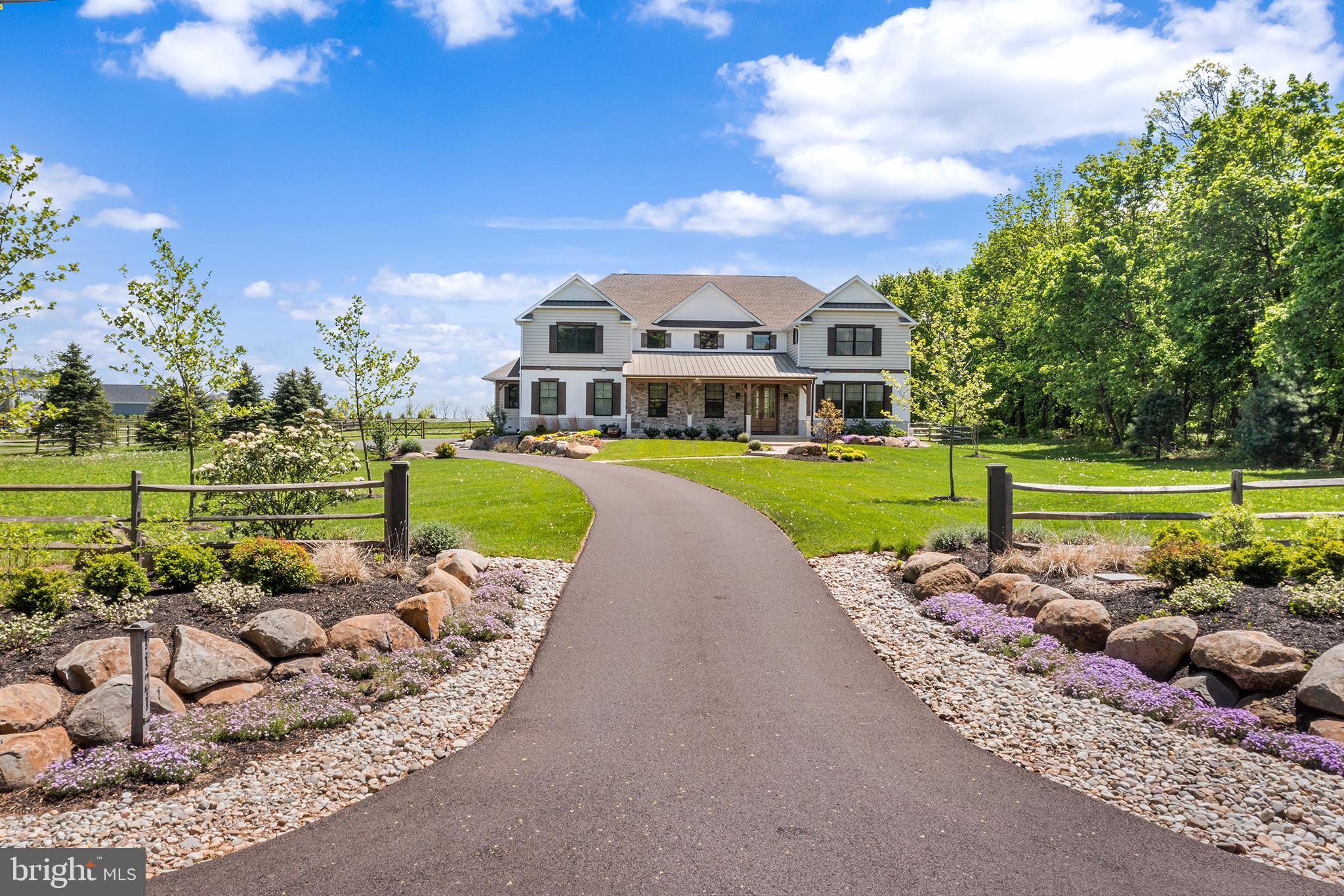 Nearly new Custom Model Home for Sale.  You can have new construction now!
A rare opportunity to own a 5 bedroom custom-built modern farmhouse in one of Bucks County’s most exclusive locations in the Vineyard at Peace Valley community.   Located walking distance to Lake Galena offering quiet every day living, with easy access to major roadways, shopping, local restaurants, parks, and the highly sought-after Central Bucks School District.    Beautiful fenced in back yard.
Enjoy walking, kayaking, boating, biking, hiking and picnicking at Peace Valley Park and Lake Galena.
This custom 5-bedroom modern farmhouse is on a beautiful 1.88-acre lot. This home is full of high end custom finishes with high-quality craftsmanship and attention to detail.    You will enjoy sitting on your covered front porch featuring elegant timber columns, a grand entrance with double knotty alder solid wood doors, and a blend of siding and stone.  Listen to the tranquil sound of the water feature while you enjoy the beautiful extensive front landscaping.   The rear deck features a pergola and expanded paver patio for everyday relaxing or indoor/outdoor entertaining.   
Inside is a grand two story foyer with views through wide-open floor plan with 10’ ceilings and 8’ solid core doors throughout.   The Gourmet Chef's Kitchen is the heart of the home with a large island, high end Cafe Appliance Package, open to the two-story grand 20 x 21’ dining area and great room with walls of glass to capture the views of the scentic back yard from every angle.   Two huge walk-in pantries featuring custom built in wood shelving for ultimate storage and organization.  The house has incredible custom millwork and built-ins throughout, with the signature craftsmanship and design that Casadonti Homes is known for.   The main level, features  en suite bedroom suite with an additional bonus room that can be utilized as a living room, flex space, 2nd office, playroom.  The large Mudroom with built-in cabinetry provides a separate family entrance with tons of storage space or area for pets.    The second floor featurins an Owner’s Suite complete with three closets, each with custom wood shelving. The Owner’s Suite Bathroom offers features a free-standing soaking tub, large double bowl vanity, walk-in shower with custom tile details, and linen closet.  Three additional large bedrooms with spacious closets, all featuring custom shelving, provide comfortable living spaces. An hall bath with designer vanity and tile details and a huge laundry room with cabinetry complete the second floor.  This remarkable home offers five bedrooms, two bonus/flex spaces, and 3.5 baths, with open gathering areas and private office and bedroom suite and flexibility to suit your needs.   This home features an oversized three-car garage and full basement with high ceilings ready to be finished.  There is an Option for the Builder to add an additional full bathroom on the second floor if Buyer chooses.    Buyer can select layout and design.  This is a limited opportunity to own a nearly new luxury custom home in The Vineyards at Peace Valley Winery built by Casadonti Homes.  Enjoy the best of both worlds with quite country living, with modern amenities and conveniences walking distance from Lake Galena and just minutes from downtown Doylestown..  This house has it all!