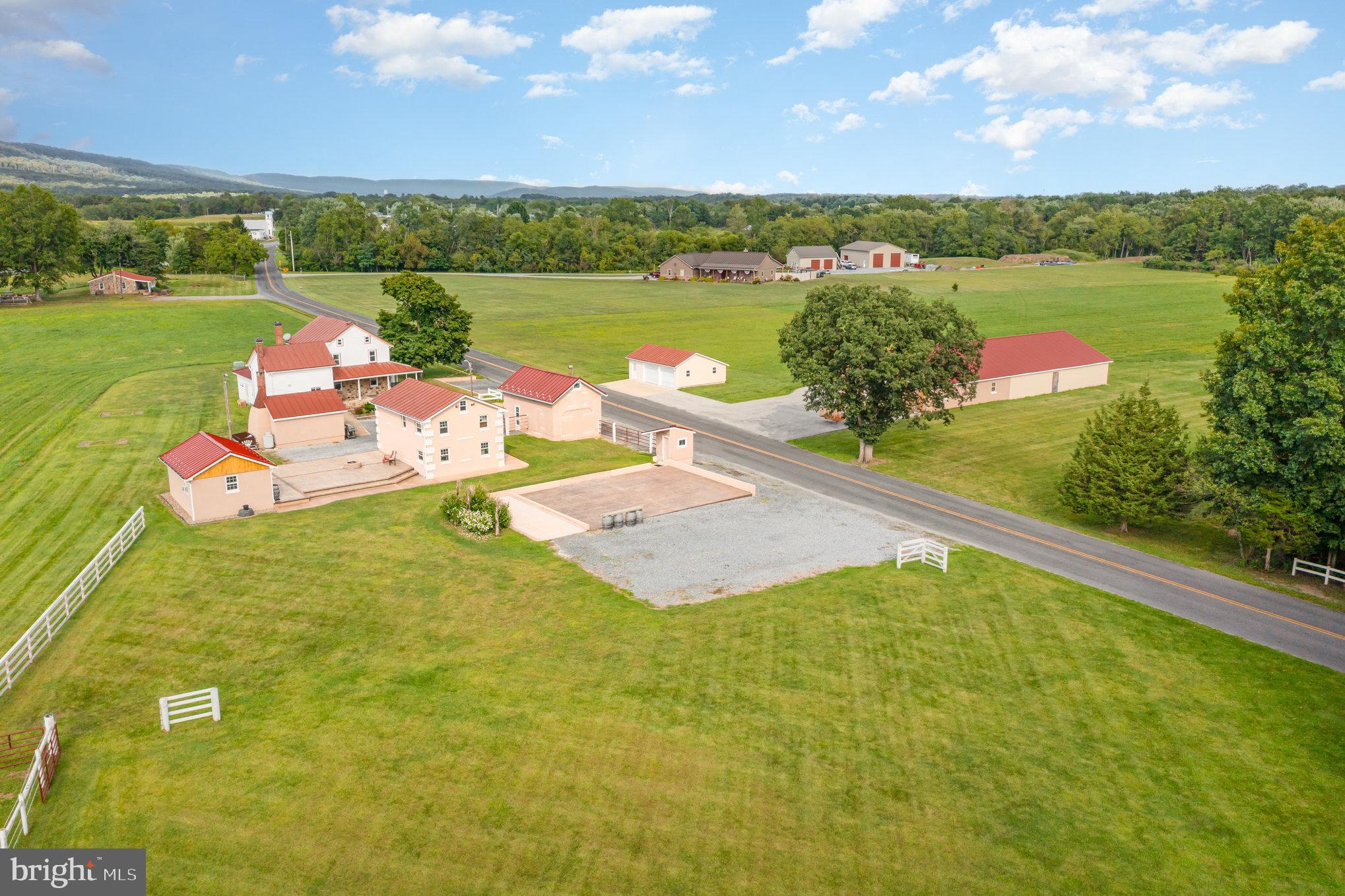 Welcome home to this charming property situated in the Northern Lebanon School District!  Boasting nearly 30 acres of picturesque farmland, this property features a lovely 1,927 square feet stone farmhouse with wrap around front porch that was built in 1850,  along with additional outbuildings! This property exudes a unique rustic charm that is hard to find.  As you approach the property, you will be greeted to the serene beauty of the surrounding countryside and the spacious acreage that allows for endless possibilities. Step inside the farmhouse to find ample living space with wood floors, beams and columns providing for a cozy living space. Kitchen features tile floors, beautiful cherry cabinets, granite countertops, stainless steel appliances, eat-in bar and breakfast space and a pantry cabinet for storage. Main level full bath and laundry with storage. Make your way upstairs to find three generous bedrooms and a full bath. Third level features an attic space for additional storage space. Outside, the property is a farm lover's dream, with plenty of space to explore and enjoy the outdoors! Unfinished basement. Property features multiple buildings including a barn, game room building and summer house for plenty of space. Whether you want to take a leisurely walk through the fields or simply soak up the tranquil ambiance of the countryside, this property has it all. Conveniently located and in close proximity to Hershey amenities, along with nearby access to highways for an easy commute. With its unique blend of farmhouse charm and modern amenities, this property is the perfect place to call home. Metal roof is on schedule to be painted this summer. Property has also held numerous weddings/events and could make a wonderful event venue. Don't miss your chance to experience the peaceful beauty of this stunning property.  Property consists of one parcel with 23.09 acres  and another 6.69 acres ready for you to build your dream home.