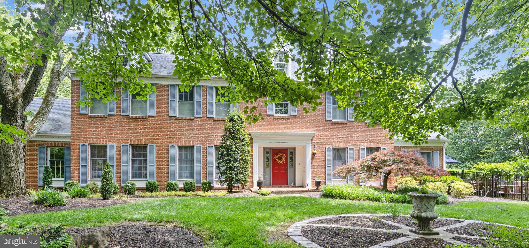 Welcome to Hidden Acres, a stunning manor home on two plus acres in the heart of Gwynedd Valley in Gwynedd Knoll.  A picturesque driveway leads to this majestic home tucked back from the road within its serene setting.  A classic center hall colonial reminiscent of Williamsburg with its gracious two-story foyer with curved staircase is flanked by formal living room and formal dining room. The dining room  accommodates a large dining table and has a secondary door to kitchen making entertaining a breeze. The living room  is where you will host guests on holidays or special occasions, place your piano, or furnish a quiet area to read or relax. Crown molding, chair rail, and hardwood floors are abundant throughout the first floor, a symbol of the handsome framework of this stately manor home. The sophisticated remodeled powder room is ideally situated within the center of the home. The center hall leads to a warm and comfortable family room with corner wet bar, bay window, outside door to trex deck, double-facing gas fireplace and bay window with sweeping view of backyard oasis. Adjacent to the family room is the outstanding game room with raised gas fireplace double-facing hearth, hardwood floors and two walls of custom built-ins along with door to additional private side brick patio with sitting wall. The side brick terrace is ideal with barbecue and dining area looking over expanse of large side property providing delightful panorama in all seasons.  Large and warm remodeled “chef’s delight” kitchen with wide plank hardwood floors includes a DACOR professional six-burner gas stove with hood and double wall oven, center work island, botanical tile back splash, stainless steel appliances, and pantry. The large sunlit breakfast room with vaulted beamed ceiling, wainscoting and large slider to the backyard can easily accommodate everyday family dining. Separate home office off the breakfast room and laundry room is highly useful in today’s working-from-home environment or can alternately be used as a home command center.  The curved staircase in the two-story foyer has hardwood floors and leads to the spacious second level.  The master bedroom suite contains a restful sitting area with gas fireplace along with a remodeled bath with soaking tub, stall shower, double sink and adjacent convenient dressing area with built-ins and full closet. The owners added a very large separate closet room within the master bedroom suite near the sitting area accented by architecture detail. The closet room’s professionally designed and organized storage space for your wardrobe and accessories for all seasons will not disappoint. You will have all of the closest space you have dreamed of. Three well-sized and well-located secondary bedrooms provide plenty of space for family, guest rooms or additional home office space. The remodeled neutral hall bathroom is well situated for all three bedrooms. The piece-de-resistance of this property is the backyard oasis with stunning in-ground pool and panoramic views of professional designed landscaping, flower beds, sitting walls and gardens. The large brick terrace and deck area are where you will spend all times of the day to enjoy the peace and serenity the gorgeous views this two plus acre property provides. Black perimeter yard fencing of the pool, back and part of side area are in-keeping with elevated nature of this home and property. Two plus acre property continues beyond the black fence to side yard.  Attached three car garage provides interior parking for all of your motor vehicles, bikes and storage. The exterior of the home  is brick and vinyl. Storage continues in the basement with copious built-in shelving for all of your additional storage. Located within Wissahickon School District and convenient to all wonderful area shopping and transportation, this home is one you will love to call “Home”.