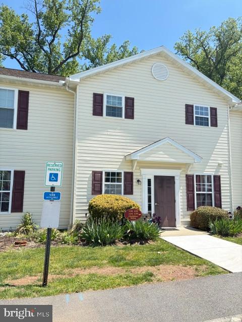 If you're looking for true one floor living with no steps or curbs, this is it!  Located in the newer section of this complex with close access to major roads, yet tucked away in a quiet development is where you'll find this gem with easy parking right outside your condo for a quick trip from your car to your home.  This easy living lifestyle continues with brand new luxury vinyl plank flooring, a new energy efficient HVAC system, a new hot water heater, a new washing machine, and all appliances remaining.  Lawn care and snow removal is also taken care of for you!   The primary bedroom, located in the back of the unit, offers a generous walk-in closet and full bath with a walk-in shower, and a 2nd bedroom and another full bath is located in the front of the unit.  A cozy gas fireplace provides ambiance and warmth during the winter months, and from spring to fall you'll find yourself living outside on your private patio that backs up to a wooded backdrop and a walking trail, providing a peaceful oasis.