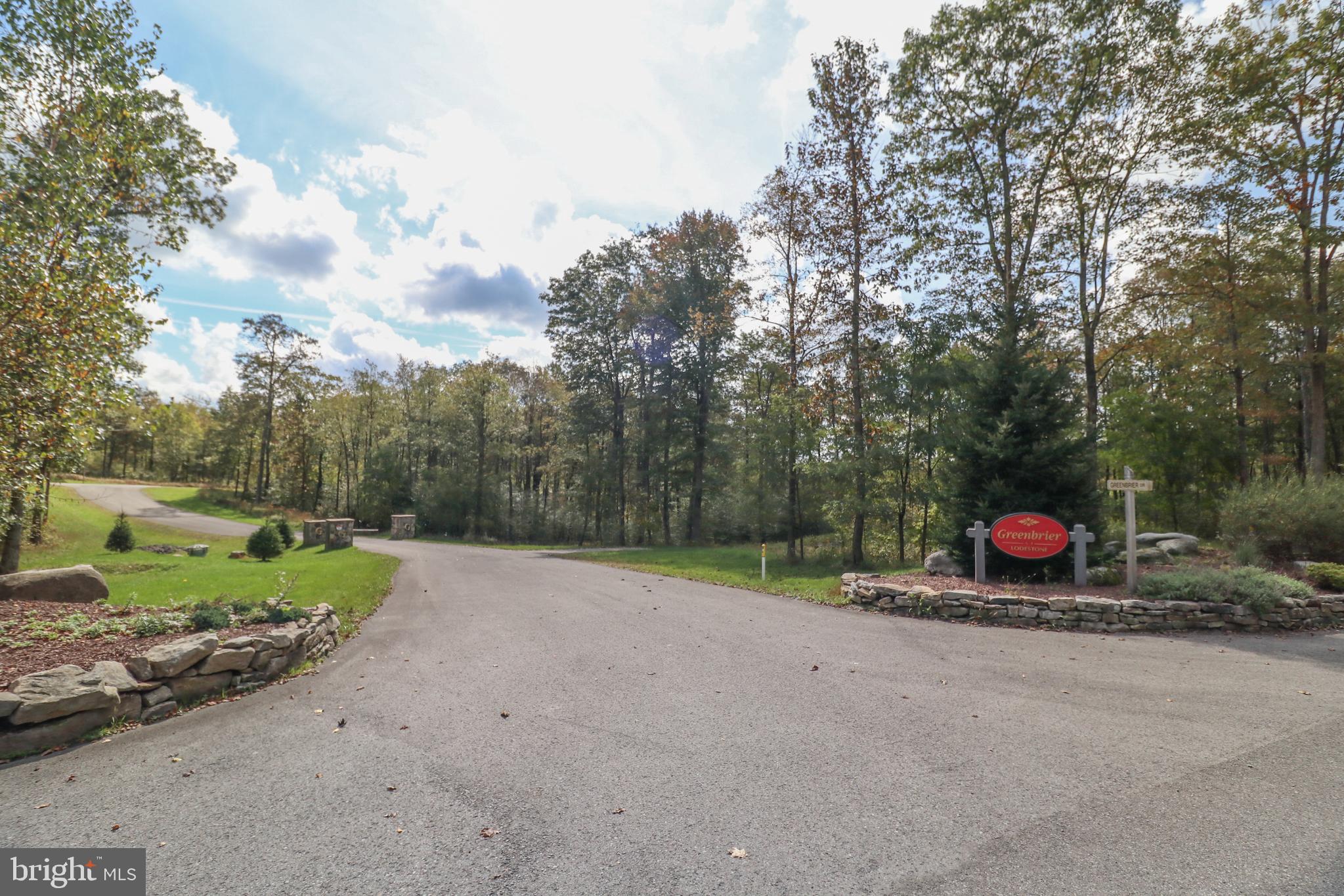 Lot 29 is in the exclusive Greenbrier community at the Lodestone Golf course along the fairway of the 8th hole.  The location is perfect to provide some peace and quiet and still be with in minutes of the Wisp Resort activities.  Snow skiing,  Mountain Biking, Whitewater rafting park, summer concerts, Mountain coaster,  Ropes course, Snow tubing park.  Also just minutes to  Deep Creek Lake and Fork Run park.  Oh yea, did I mention the championship Lodestone golf course  designed  by 3-time U.S. Open Champion Hale Irwin, Lodestone Golf Course is in a league all its own.  Experience the #2 Ranked Public Golf Course in Maryland by GolfWeek Magazine.  There is also a buffer strip of ground that no one can build on along this property.  This community is a member of the Wisp Resort Master Association which owns a lakefront parcel near the end of Marsh Hill Rd.   This community has access to the lake through the Master Association. It's a "Class 3 Lake Access" which means they can use the park, the pavilion, and the restrooms. They can walk along the shore of the lake and fish.