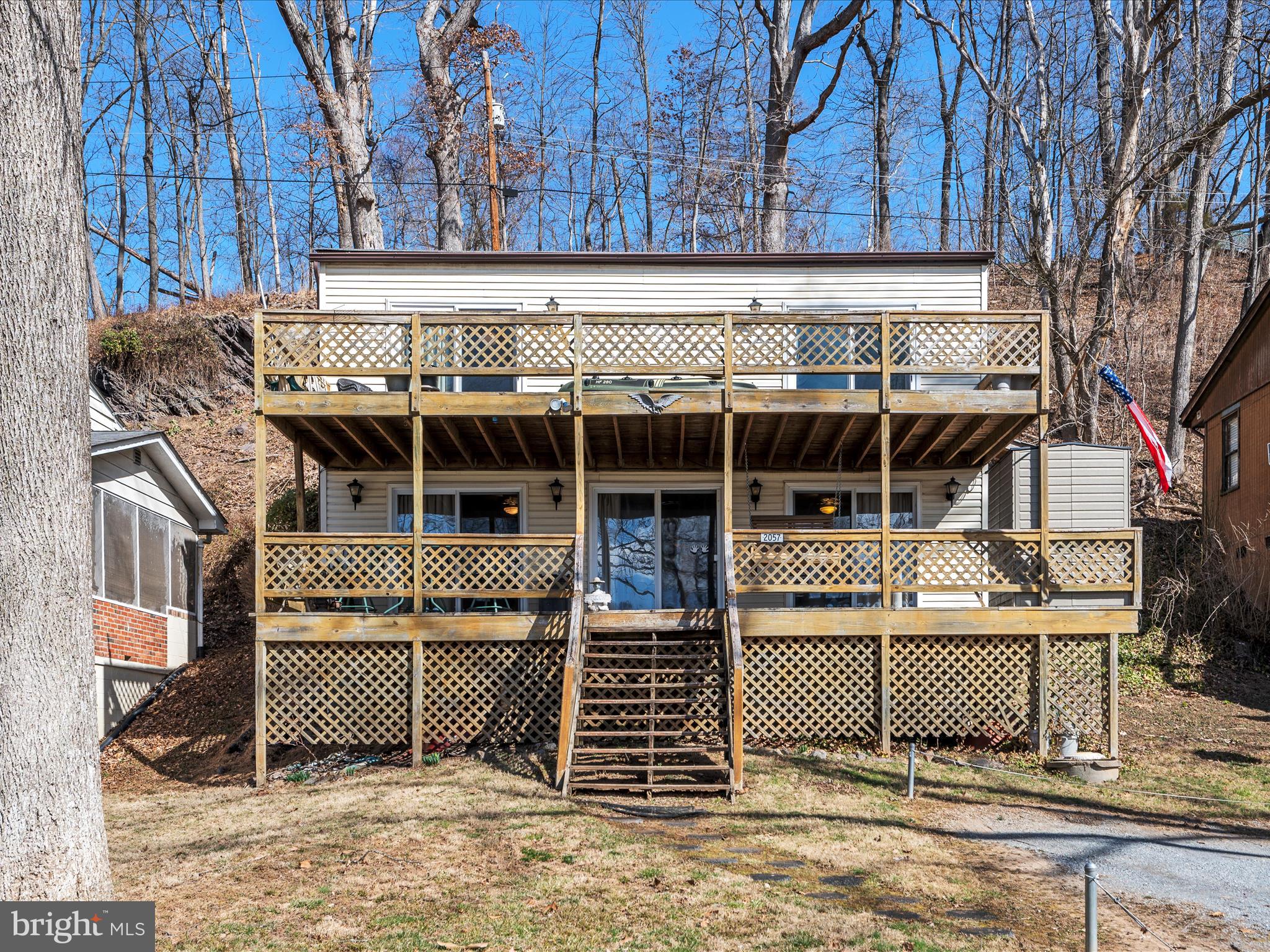 Welcome to 2057 Lockes Mill Road, a rare waterfront gem offering endless opportunities—whether as a primary residence, a second home, or an investment property. Nestled right on the banks of the Shenandoah River with direct access just steps away, this 3-bedroom, 2-bath retreat is the perfect escape from the hustle and bustle of city life.

Designed for both relaxation and entertainment, the home features an open-concept layout with abundant natural light and a two-story front porch spanning the entire width of the home—the perfect spot to take in breathtaking river views. With year-round access to outdoor adventure, this home is an ideal getaway in any season—whether you’re kayaking, fishing, tubing, or simply unwinding by the water. The prime location makes it a fantastic investment for short-term rentals, vacation home potential, or a private retreat just a short drive from the city.

Escape the noise and embrace the tranquility of riverfront living—all while enjoying the benefits of a sound real estate investment. Don’t miss this incredible opportunity!

Schedule your private showing today.