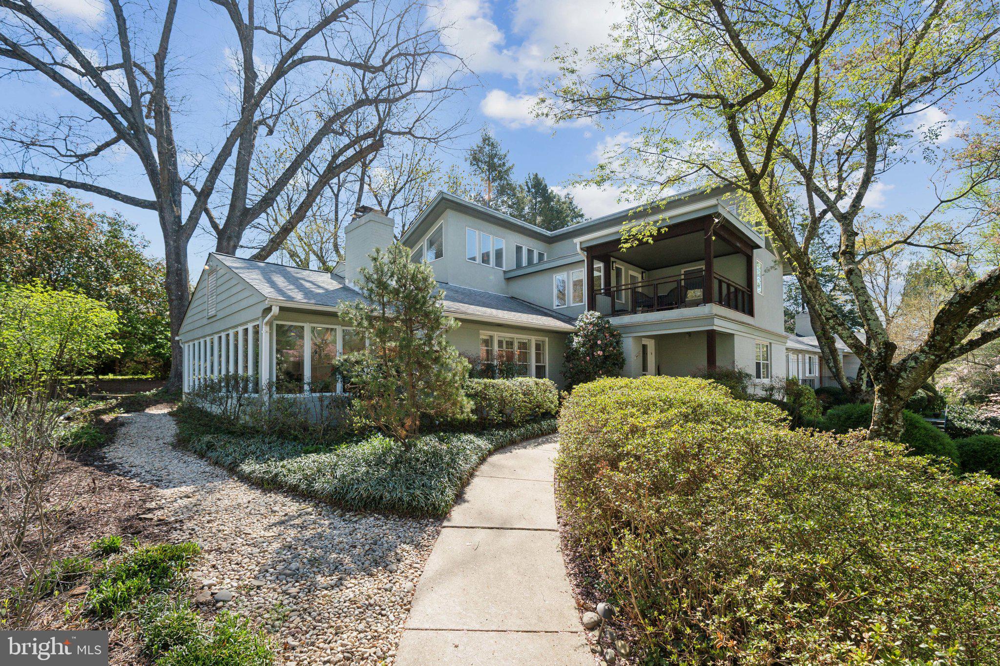 This light filled one-of-a-kind contemporary home is located in the highly desirable neighborhood of Rock Creek Hills, a stone’s throw from the walking trails of Rock Creek Park and with easy access to the Beltway.  Its unique design includes a skylight and two balconies on the upper level, one facing the street and the other the backyard thereby providing outdoor access from multiple points in the house. The master suite includes a walk-in closet with built in cabinetry, a sitting area and bathroom with walk-in shower and a soaking tub. With all these architectural features you’d never know that this house is fully accessible on all three floors connected via an elevator. A second bedroom completes the upstairs design. On the main level you'll find two bedrooms, including one with an ensuite bath, plus a separate office space-perfect for working from home. The newly remodeled kitchen is both a showstopper and a chef’s dream leading to a bright, airy dining room and offering easy access to the back deck, making outdoor entertaining a breeze. The living room is warm and inviting, with built-ins and a cozy wood-burning fireplace. The lower level provides ground-level access from the garage and a staircase to the backyard. This space includes a generous family room with another wood-burning fireplace, a versatile bonus room-ideal for a gym, playroom, or office-plus a laundry room and ample storage. This home is truly a gem, combining style, functionality, and accessibility in a fantastic location.
