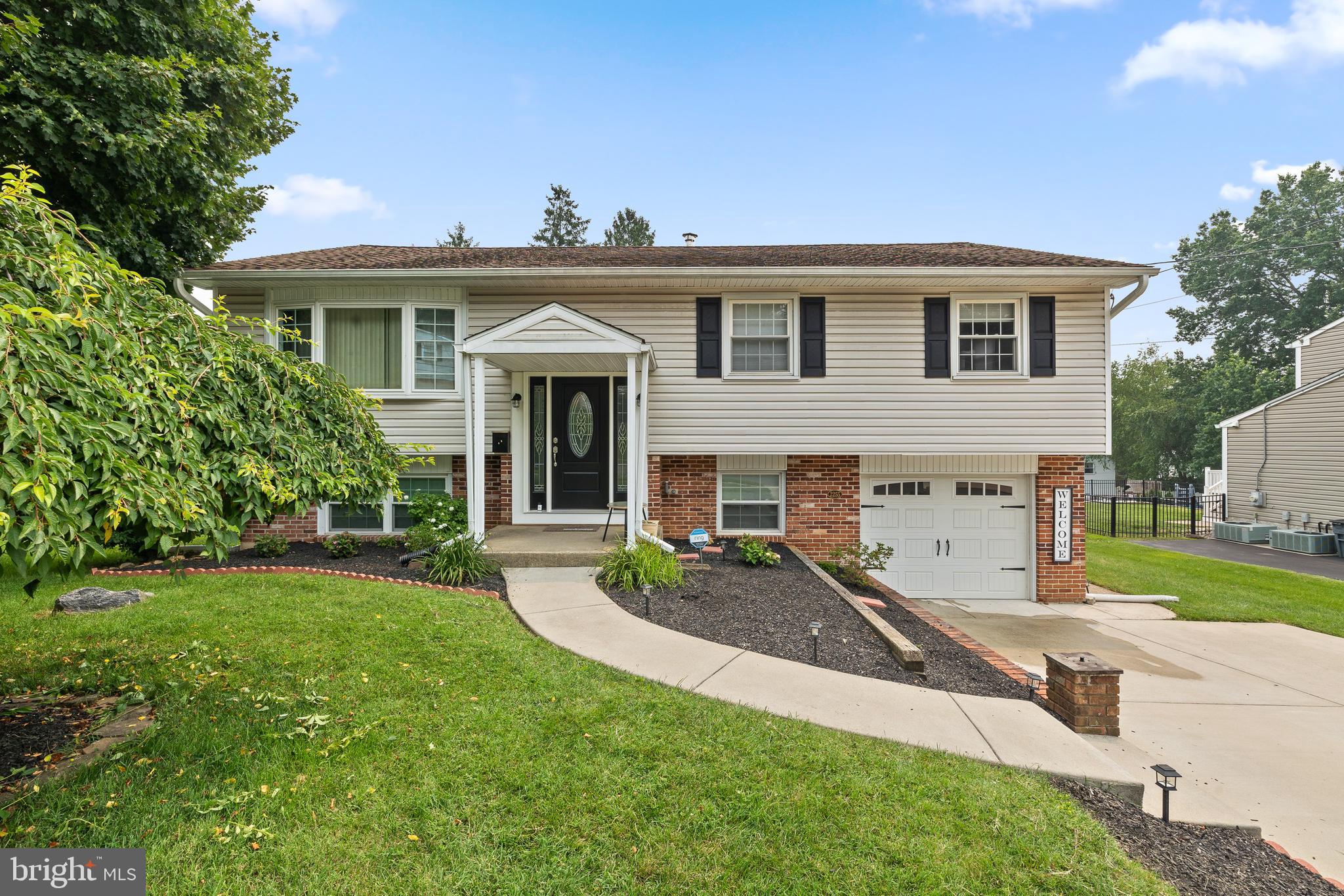 Welcome home to this charming four-bedroom, 1.5-bath split-level home in desirable Aston Township! Situated on over a quarter-acre, this lovingly maintained property offers the perfect blend of modern updates and timeless character. Located within the highly regarded Penn-Delco School District, this home is ready for its next owners.

Step inside to the inviting main level, where you’ll find an updated kitchen featuring a center island with seating, newer flooring, and a spacious dining area that’s perfect for everyday living and entertaining. New lighting throughout the home adds a bright, fresh feel. Three comfortable bedrooms and an updated full bathroom complete the main level.

The lower level features a cozy family room with brand-new luxury vinyl plank flooring and a wood-burning fireplace, perfect for relaxing on chilly evenings. A new chimney liner has been installed for added peace of mind. This level also includes a convenient half bath, laundry area, garage access, and a versatile bonus room that can serve as a fourth bedroom, home office, gym, or playroom. Additional upgrades on lower level - new washer and dryer; new laundry room sink; new vanity / sink/mirror and lighting in half bath!

Recent improvements include a new electrical panel, new oil tank and oil line, a beautiful new front door (approximately a $4,000 upgrade), new toilets, new pull-down attic stairs, and refreshed landscaping, making this home truly move-in ready.

Ideally located with quick access to I-95, Route 452, and Route 322, commuting to Philadelphia, Wilmington, and surrounding areas is a breeze. You’ll also enjoy being just minutes from shopping, dining, parks, and Philadelphia International Airport, while still appreciating the peaceful charm of this established community.

Don’t miss your opportunity to make this wonderful Aston Township home your own!