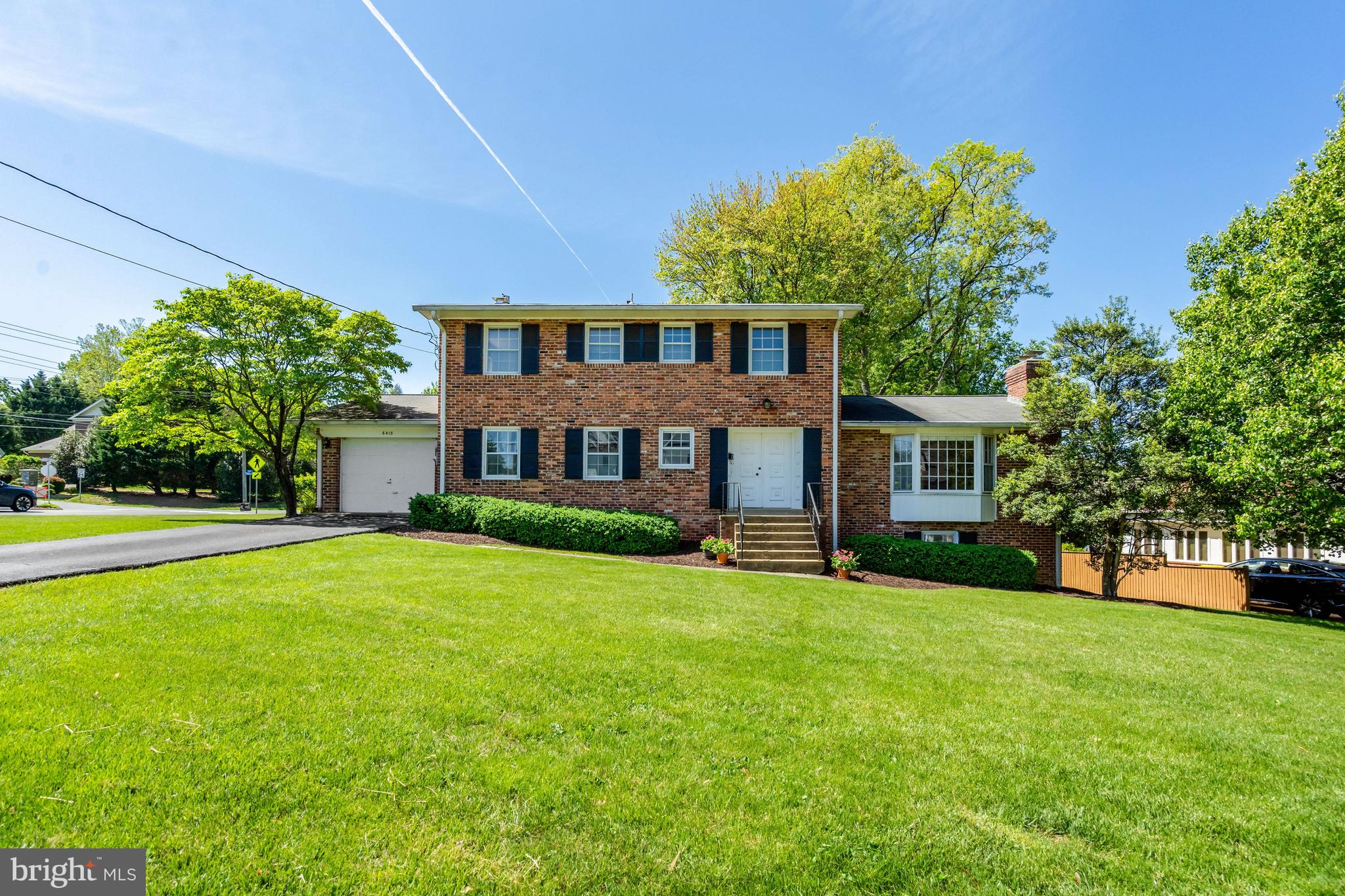 RENOVATE OR BUILD NEW:  Desirable 14,348 sq ft corner lot is ready for your vision.  MULTI-GENERATIONAL OPTIONS in this large, 5 Bedroom, 3+ Bath ALL-BRICK COLONIAL featuring a MAIN LEVEL OFFICE or BEDROOM and FULL BATHROOM.   Welcome guests through the double door entry into the roomy Foyer with slate floor.   HARDWOOD FLOORS ON MAIN AND UPPER LEVELS.   Graciously entertain in the formal Living Room with Fireplace, and in the separate formal Dining Room--both feature bay windows for lots of natural light.  The efficient, bright eat-in Kitchen also features a bay window (banquette, anyone?) for a lovely garden view, and a large pantry closet.  The Family Room, which opens onto the Deck, features a brick Fireplace wall and hearth, and has real knotty pine paneling which can be pickled or painted for a lighter look.  The Upper Level now offers a Primary BR with en-suite Bath, and 3 more BRs and Hall Bath.  The Floor Plan in the DOCUMENTS section will show easy possible renovations (2 different ways) to end up with a much larger Primary BR Suite, 2 more BRs, and hall Bath, etc., on the UL.  The Lower Level has a large Recreation Room with gas Fireplace, and a door with just a few stairs to the back yard.  Get creative with the large unfinished spaces in the Basement (wine cellar, bunker, exercise area, workshop?), which includes a toilet and sink off the laundry area, easily expandable to another Full (4th) Bath.  Room for au pair or guest room on LL.  Gas Furnace new in 2023.  Highly rated and walkable Chesterbrook ES, Longfellow MS, and McLean HS pyramid.  Property is strategically located:   various driving routes to DC via GW Parkway or thru nearby  Arlington;  about 2 miles to the West Falls Church Metro Station, and easy access to various other commuter destinations and Tysons Corner;  walk to highly rated schools, pools & tennis, shopping, dining, and other private and community amenities.