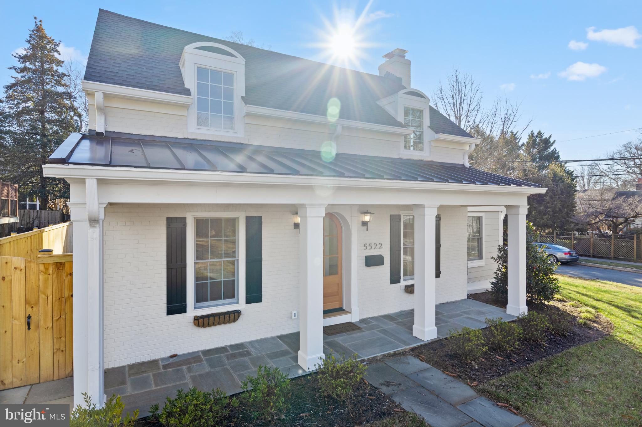 Located in one of Bethesda's most sought-after neighborhoods, 5522 Lincoln St sits on a generous 7800 sq ft lot. Meticulously redeveloped to perfection, 5522 Lincoln offers all the benefits of a new home. In the backyard, discover a separate two-story cottage. The extra space offers endless possibilities for use as an office, in-law residence or potential rental income. This versatile unit includes a bedroom, full bathroom, kitchen, loft and an office/sitting room space, catering to a variety of lifestyle needs. This structure meets Montgomery County requirements for an Accessory Dwelling Unit (ADU).

Step through the charming arched front door of the main house to discover a light-filled main floor where an open-concept kitchen with and family room beckon with natural light streaming through custom windows and patio doors. The kitchen is a chef's paradise, boasting stunning Taj Mahal quartzite countertops, custom Oak cabinetry, Wolf range and Sub-Zero appliance package. Locally sourced white oak hardwood floors grace the first two levels. A spacious separate pantry, equipped with countertop space, refrigerated beverage drawers and ample storage complements a built-in butler's pantry with a wine fridge, making entertaining an absolute pleasure. Every inch of the kitchen was designed with both everyday life and entertaining in mind. Imagine holidays around the dining room table with a glow from the wood burning fireplace. That’s what memories are made of! A cozy den and sunroom offer relaxation and retreat, enhanced by a custom powder room adorned with luxurious marble countertops. On the upper level, four graciously appointed bedrooms await, including a primary suite that is a sanctuary in itself. Enjoy your morning coffee on the Juliet balcony overlooking the beautiful landscaped backyard, while custom closets with under-mounted lighting and a sumptuous en-suite bathroom with marble tile and countertops complete this private oasis. A conveniently located laundry room ensures household tasks are a breeze. The lower level is a haven for entertainment, featuring a spacious, day-lit family room perfect for binge watching your favorite show or hosting family game night. This property is not just a home; it's a lifestyle, where every detail has been thoughtfully curated for comfort, convenience, and luxury