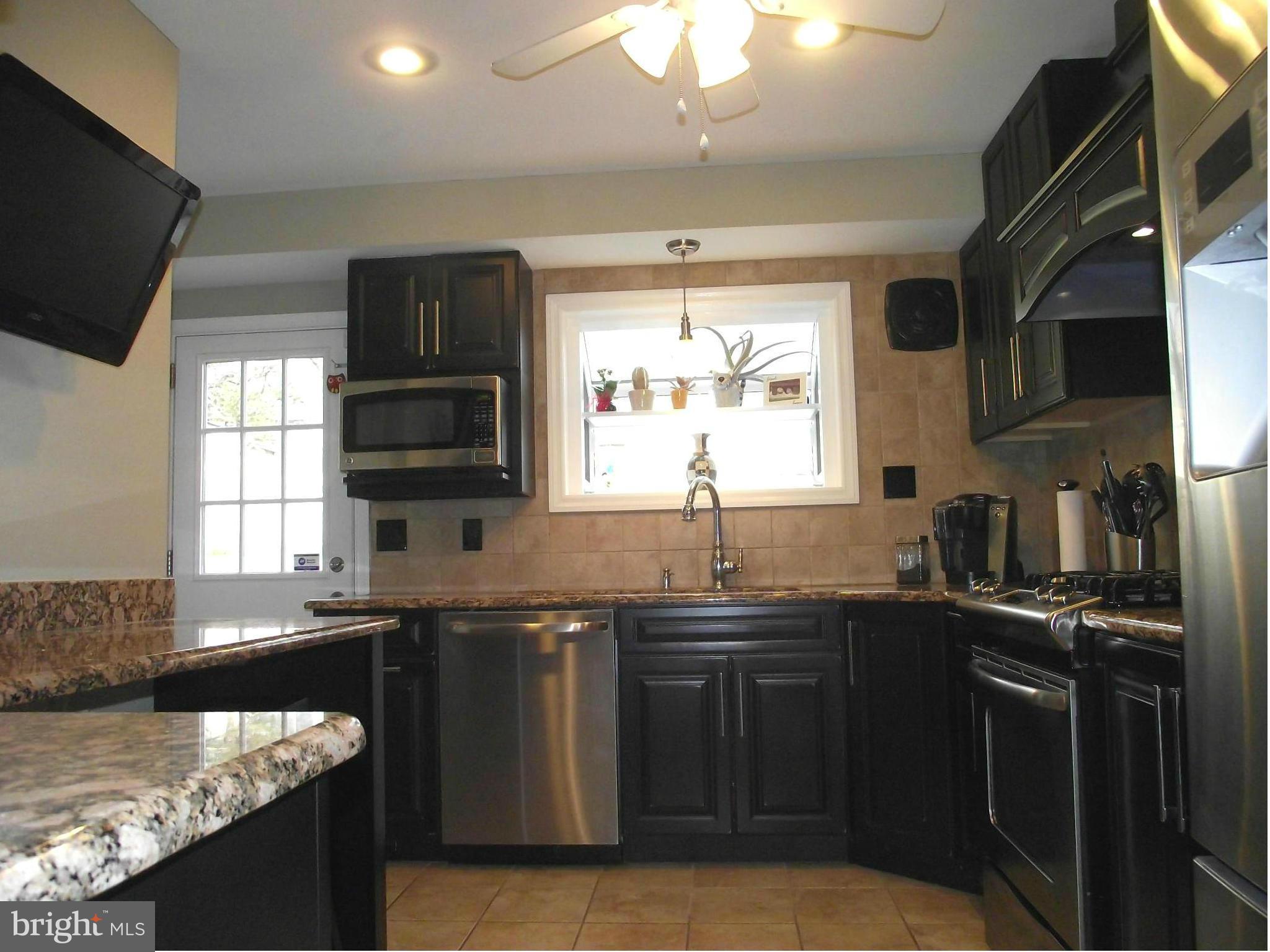 SHAKEY CONTRACT-Current buyer must settle by June 6th.  Gorgeous gourmet kitchen-Thomasville cabinetry, granite counters, gas stove, Kohler pot filler, ceramic backsplash & flooring.  Amazing master bath w /whirlpool tub plus 2 more beautifully updated full baths! Gleaming wood flooring. Lower level family rm & gym area.  Fenced backyard. Baseball field/school playground across street.