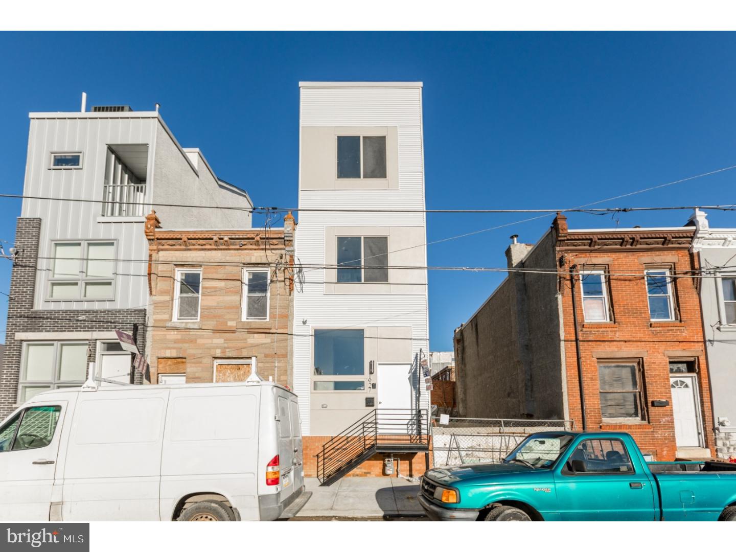 Welcome to 1927 E Letterly St. - Luxury New Construction in the heart of 19125, meticulously crafted by one of the most reputable developers in the area, delivered with 10 year tax abatement and 1 year builder's warranty! This beautiful 3 story, 3 bedroom, 2.5 bath home is equipped with all the creature comforts that you desire and also includes amazing features such as beautiful reclaimed hardwood flooring. The first floor has an open layout that includes the living room, dining area, and gorgeous high end kitchen with access to the cemented rear patio. On the second floor you will find two spacious bedrooms and three piece full hall bath. The third "master" floor includes an amazing oversized in-suite bath with twin sinks and large glass enclosed shower. The roof deck boasts stunning view of the center city skyline and surrounding neighborhood. Fully finished basement with tile floor, storage space, and laundry area. You'll be boasting to everyone you know about the location of this one - close to all Fishtown & East Kensington have to offer, with easy access to the highways and public transportation. If you've been looking to make your move into a neighborhood and home that truly has it all, look no further. We welcome your visit today!