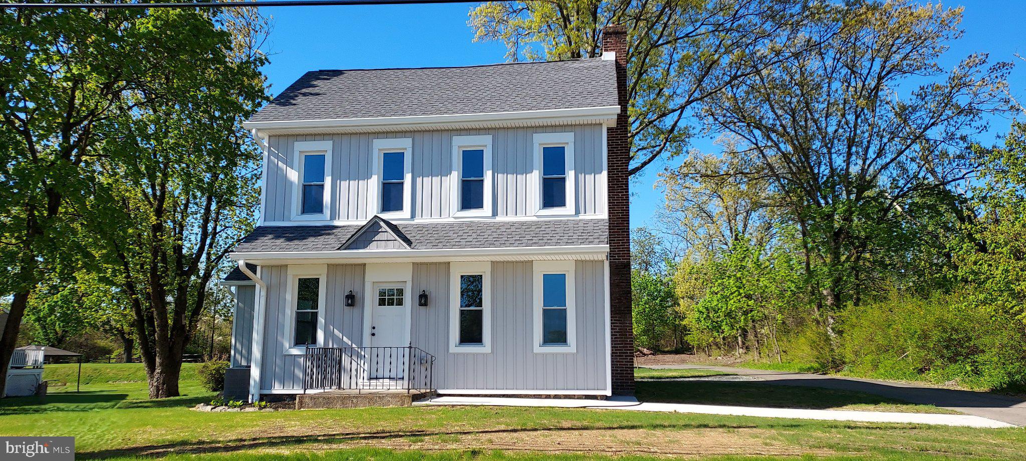 This charming colonial home, originally built in 1885, underwent a major renovation in 2025. Nestled on a generous 0.49-acre lot that adjoins public land, this property offers a unique opportunity to enjoy both privacy and the beauty of nature right at your doorstep. This residence is designed for both relaxation and entertainment. The spacious layout boasts a gorgeous kitchen with island, dining and bonus area and the inviting living area 
features a cozy fireplace, perfect for gathering with loved ones during chilly evenings. Head upstairs to the beautifully appointed bedrooms and bathrooms. The finished attic is heated and offers flex space. Step outside and enjoy the benefits of the adjoining local park, providing ample opportunities for outdoor activities, picnics, and leisurely strolls. The proximity to public land means you can explore nature trails and enjoy the tranquility of the outdoors without venturing far from home. With a detached garage accommodating three vehicles and additional driveway space, parking is never a concern. This home is not just a residence; it's a lifestyle. Imagine hosting summer barbecues on your patio, enjoying the lush greenery that surrounds you, or simply unwinding in your private oasis. The combination of finishes and thoughtful design creates an atmosphere that is inviting. Experience comfort and tranquility in this beautiful property.