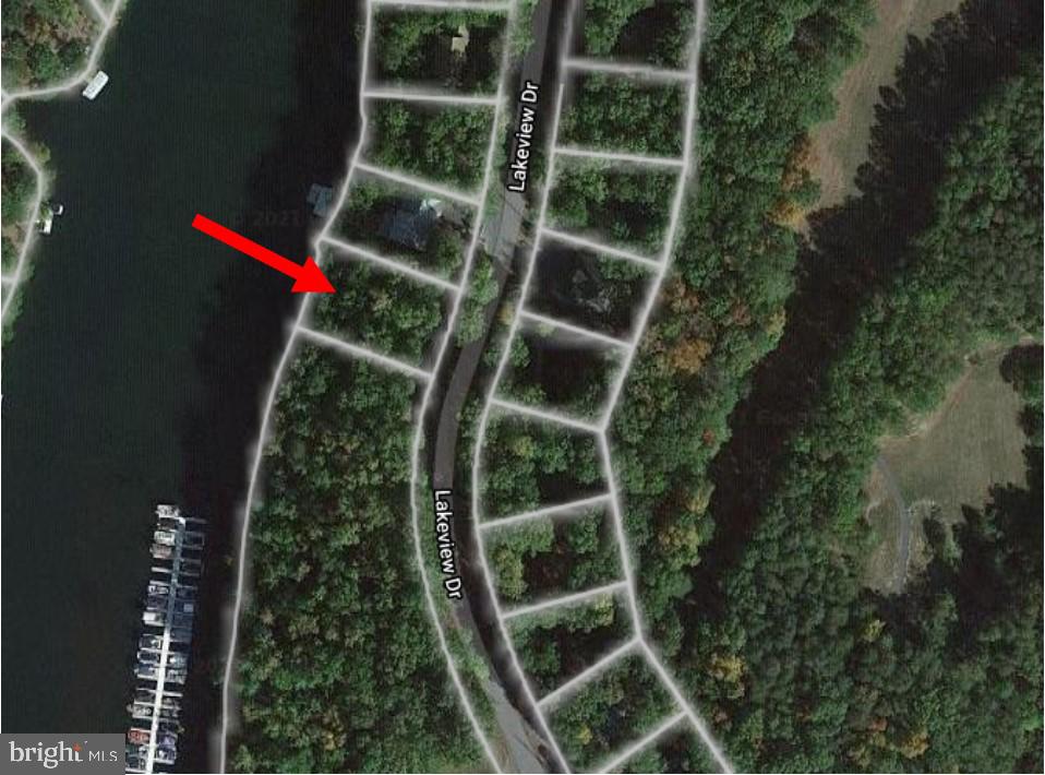 PRIME LAKEFRONT BUILDABLE LOT RIGHT NEXT TO ALL AMENITIES!  This waterfront lot has 94 feet of shoreline! You won't believe how close this lot location is to the clubhouse, tennis/volleyball/basketball courts and BEACH. Come build your dream home in this 240 acre GATED LAKE COMMUNITY just 15 minutes to Winchester and just 90 minutes to DC.  Vacation where you live where the water/sewer hookup fees are currently only 5k total hookup (please verify with Aqua Virginia), the 24/7  gated community HOA dues are only $131/monthly, and the lake is a deep water lake that can handle your power boat, kayaks, canoes, and more! Lake life at its finest and this is one of the few prime lakefront lots left to build on.