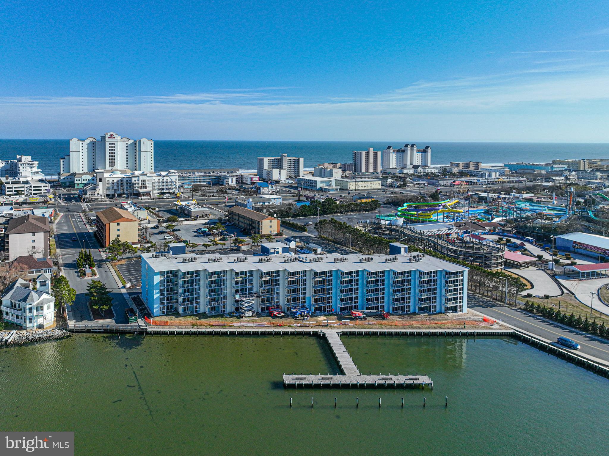 Newly Listed 402 Bay Club! Welcome to your dream coastal retreat! This stunning 2 bedroom, 2 bath condo offers the ultimate in Bayfront living. 🌅  Step inside to discover a kitchen boasting solid wood cabinets and sleek granite countertops. 🍽️ The perfect space to cook up your favorite meals with ease.
Featuring a delightful mix of tile and carpet flooring, this condo exudes comfort.  Plus, with a full-size washer and dryer conveniently located in-unit, laundry day is a breeze! 🧺 The primary bedroom is a true sanctuary, complete with corner windows that flood the room with natural light. Open the sliding door and step out onto the balcony to indulge in breathtaking bay views. 🛌💖 Imagine waking up to cruise-like vistas and enjoying breakfast in bed. Pure bliss! 🚢☕ But that's not all! The building offers an array of amenities including a year-round indoor heated pool for relaxation anytime, and two parking spaces for peace of mind. 🏊‍♂️🧺🚗 With on-site professional management and maintenance, you can rest easy knowing that everything is taken care of. ✨ Included in the condo fees are water, cable, and internet.  
And let's not forget the recent renovations! New windows and sliding balcony doors, the lobby, exterior of the building, and balconies have all been beautifully redone. 🏢✨Don't miss out on the opportunity to experience Bayfront living.  Water, Internet and Cable included in the condo fee.