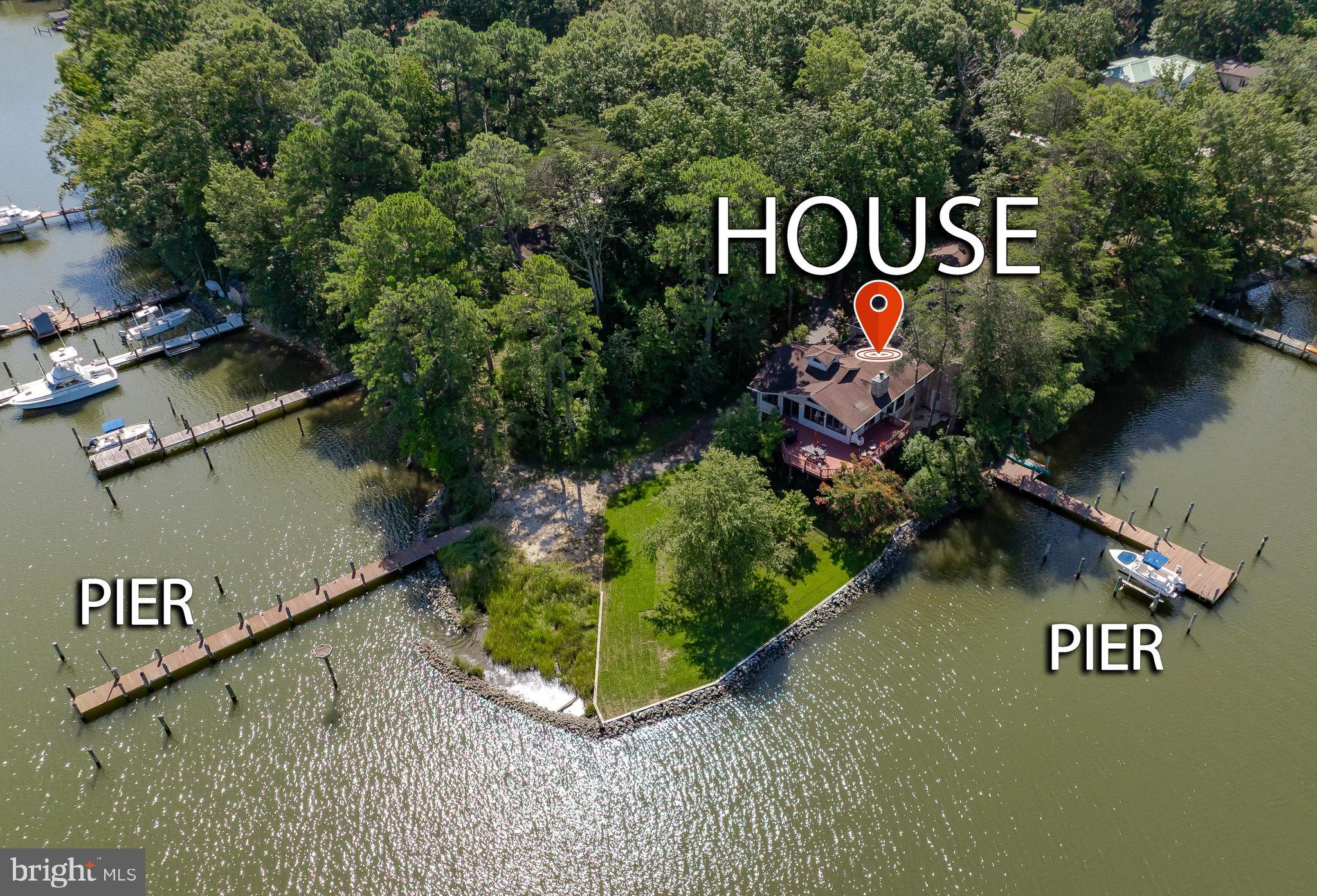 Prepare yourself for a waterfront opportunity like no other. This extremely well-maintained property has several extraordinary attributes, one being, it is not viewable from the street. The property is close to one acre, and boasts 350 feet of rip rapped waterfront, coupled with two piers, both deep water for power and or sailboat,three-car garage for the automobile enthusiast, a master bedroom suite like no other, with attached sunroom, and private deck. The main house offers three additional bedrooms and baths, all with two baths, fireplace, tremendous water views. The main great room has a  stone fireplace, vaulted ceilings, and views up and down Mill Creek. The property sits on a point of land, hardscape, well landscaped, piers are in excellent condition, and boat lift for the runabout.  Several different entertaining areas throughout the entire property. Again, definitely one-of-a-kind property. Brick front walkway is amazing. Downstairs great room has views up and down Mill Creek also . This property is located in Drum Point. Minutes by boat to Historic Solomons Island the Patuxent river and Chesapeake bay.  The Solomons Bridge is viewable from the decks and from the bay windows in the Great Room. It is one hour to Annapolis, one and a half hours to Washington, D.C., and an hour and 15 minutes to International Airport.