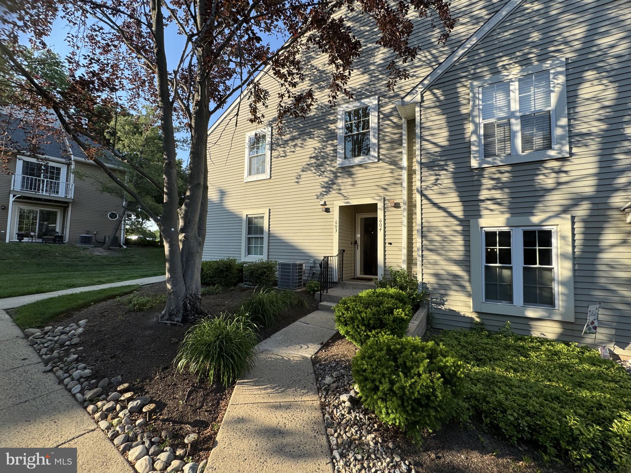 Discover an unparalleled lifestyle in this exquisite second floor 2-bedroom, 2-bathroom condo nestled within the prestigious Newtown Grant community which is located in the Council Rock School District! 

This contemporary gem has "just" undergone a major renovation and promises to elevate your living experience with its luxurious features and exceptional amenities: All new Windows, New HVAC, New Hot Water Heater, New Sliding Glass Door, New Luxury Plank Flooring, New Carpeting in the bedrooms, New Stainless-Steel Appliances, New Espresso Solid Wood Cabinetry, New White Quartz Countertops / Breakfast Bar, New Tile Backsplash, New Wood-look Porcelain Tile Bathroom Floors, New Vanities, Toilets and Glass Walk-in Shower, an "enlarged" Storage Closet with an added Pocket Door, Freshly Painted throughout, the "Kitchen Wall was removed to open up the floor plan", a Large Refrigerator (Let’s face it, who wants a small refrigerator?) was added  and relocated to add more counter space and large Kitchen Drawers that's perfect for storing pots & pans in , A Laundry Room with Washer/Dryer included, all appliances shall convey in their present condition, the Roof was replaced in 2023, the Siding on the building is projected to be replaced within the next 5 years, The Fireplace and Gas chimney were already just certified.  New, New, New! Outside, the allure continues with a private balcony with storage closet that overlooks serene, wooded views and this end unit is close to the parking lot and is also easily accessible from the parking lot in the front court without facing the parking lot!

The association fee covers essential services such as lawn maintenance, snow removal, and access to the community pool and other amenities designed for an active lifestyle with absolutely no maintenance to do on your days off, including: tennis courts, a swimming pool, a baseball diamond, a tot lot with fun play equipment, a volleyball court, picnic areas, sprawling green space and a recreational center. 
Enjoy leisurely strolls along the walking/bike trails or engage in friendly matches at the basketball and pickleball courts.