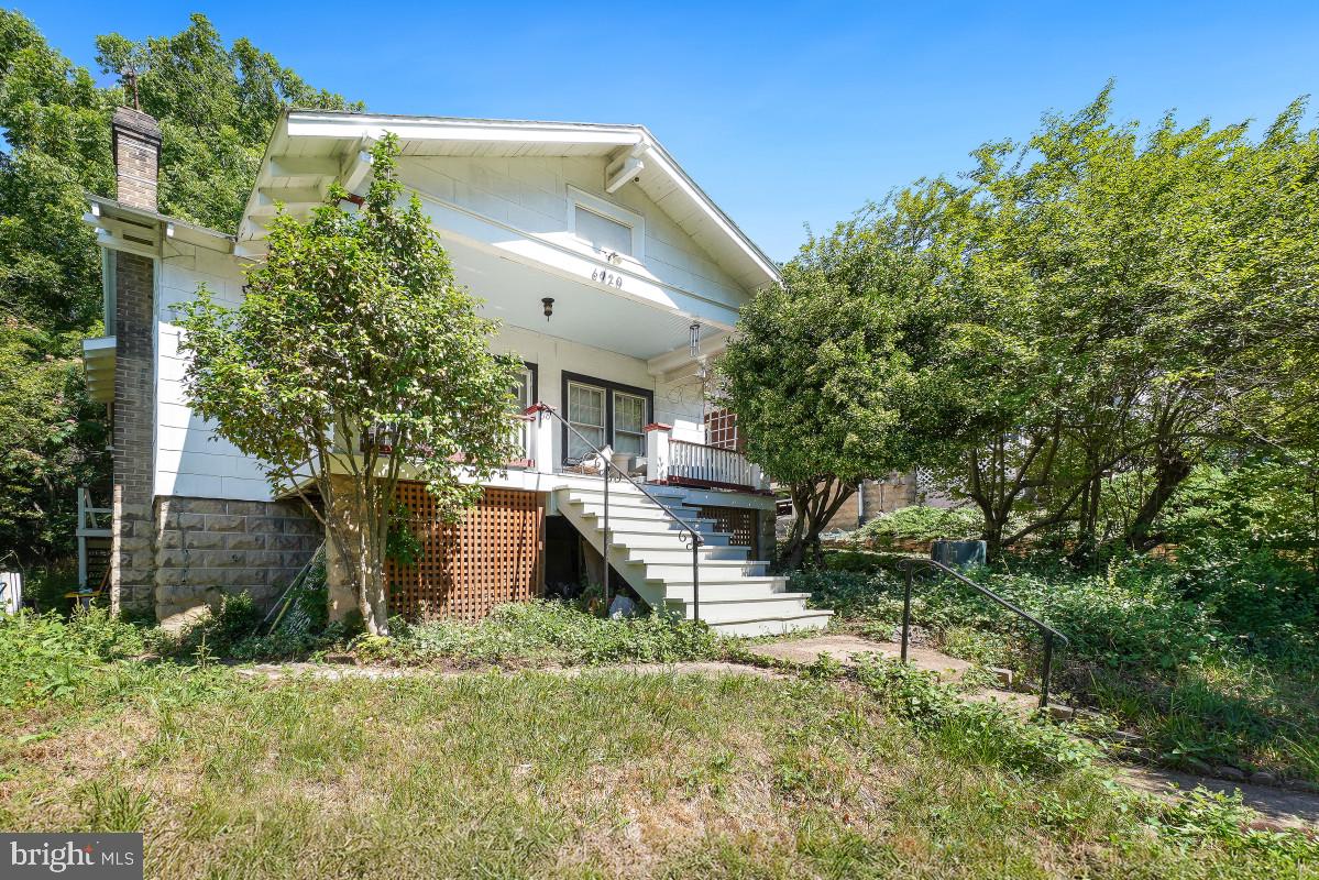 Charming circa-1925 bungalow brimming with potential on a delightful hillock overlooking popular Forest Park - talk about a  sylvan setting! Set on an exceptional 10,000-square-foot lot, this classic home presents a wonderful opportunity to renovate, expand, or build your dream home. A welcoming living room with a fireplace flows into the dining room, while the kitchen is located at the rear of the home with access to the backyard. The main level includes two bedrooms and one full bathroom. An unfinished lower level provides laundry, abundant storage, and future expansion possibilities. Sidewalk-lined streets, mature surroundings, and the expansive backyard complete this rare offering in a sought-after neighborhood.

Enjoy an unbeatable location just moments from Old Town Takoma and the Takoma Park-Silver Spring Co-op. With the Red Line Metro station approximately one mile away, commuting is a breeze, while nearby Colby Park, Jackson Boyd Neighborhood Park, and Spring Park provide wonderful green spaces for outdoor recreation. A rare opportunity to create something truly special in one of Takoma Park's most beloved neighborhoods.
