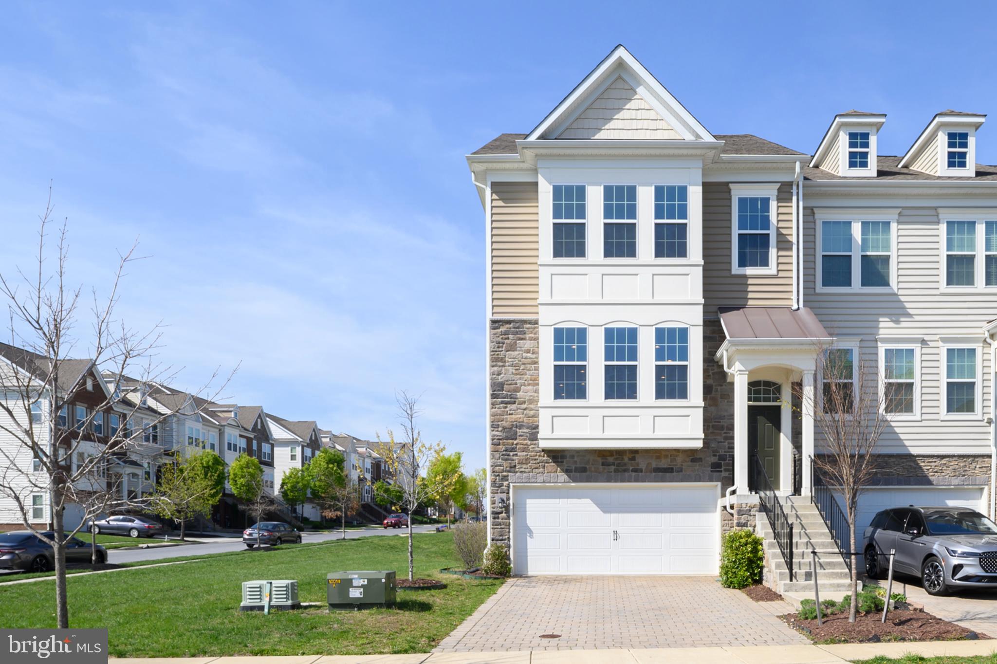 A rarely available luxury end unit townhome in the sought after community of Wincopia Farms in Howard County!  The main level has 9 ft ceilings, an open floorplan with hardwood floors, a large family room and dining room that are completely open to the kitchen with an oversized island that offers plenty of seating, granite counters, stainless appliances, pantry and a sunroom in the rear with deck access.  Upstairs you will find 3 bedrooms, 2 full baths including a primary suite, upper-level laundry and an upper-level storage closet.  The primary suite includes a sitting room, walk-in closet, tray ceilings, recessed lights and a primary bath with a soaking tub, dual sinks as well as a separate shower.  The walkout basement level is an open floorplan with 9 ft ceilings, and a large recreation room that could be used as a living room, playroom or even a home gym.  It offers a full bathroom, additional storage and access to the 2-car garage that has additional storage as well.  An ideal location just minutes from shops, restaurants, historic Savage Mill, hiking trails and convenient access to major commuting routes, Ft. Meade, Columbia, Baltimore & Washington DC with access to 29 | 95 | 32 | 295 | Rte 216.